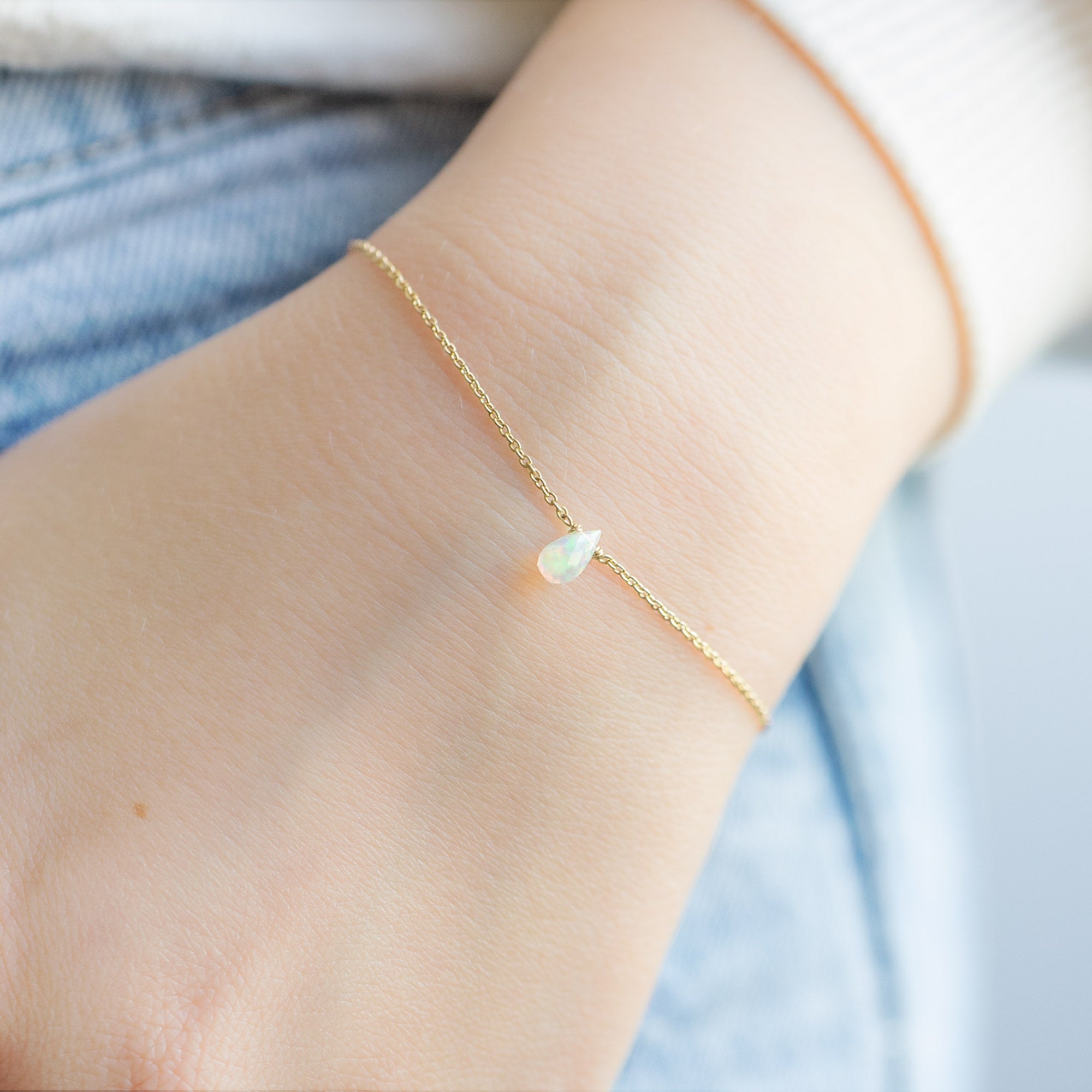 The Opal Teardrop Bracelet in Yellow Gold Filled on Model