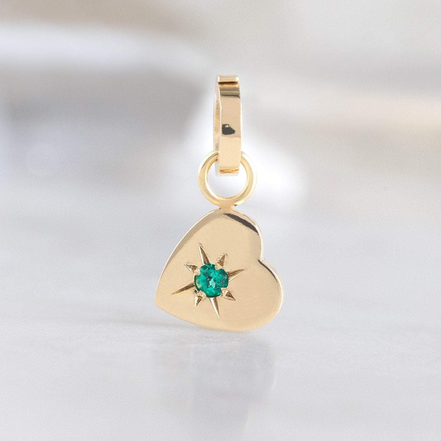 The Heart Charm in 10K Yellow Gold on White Marble