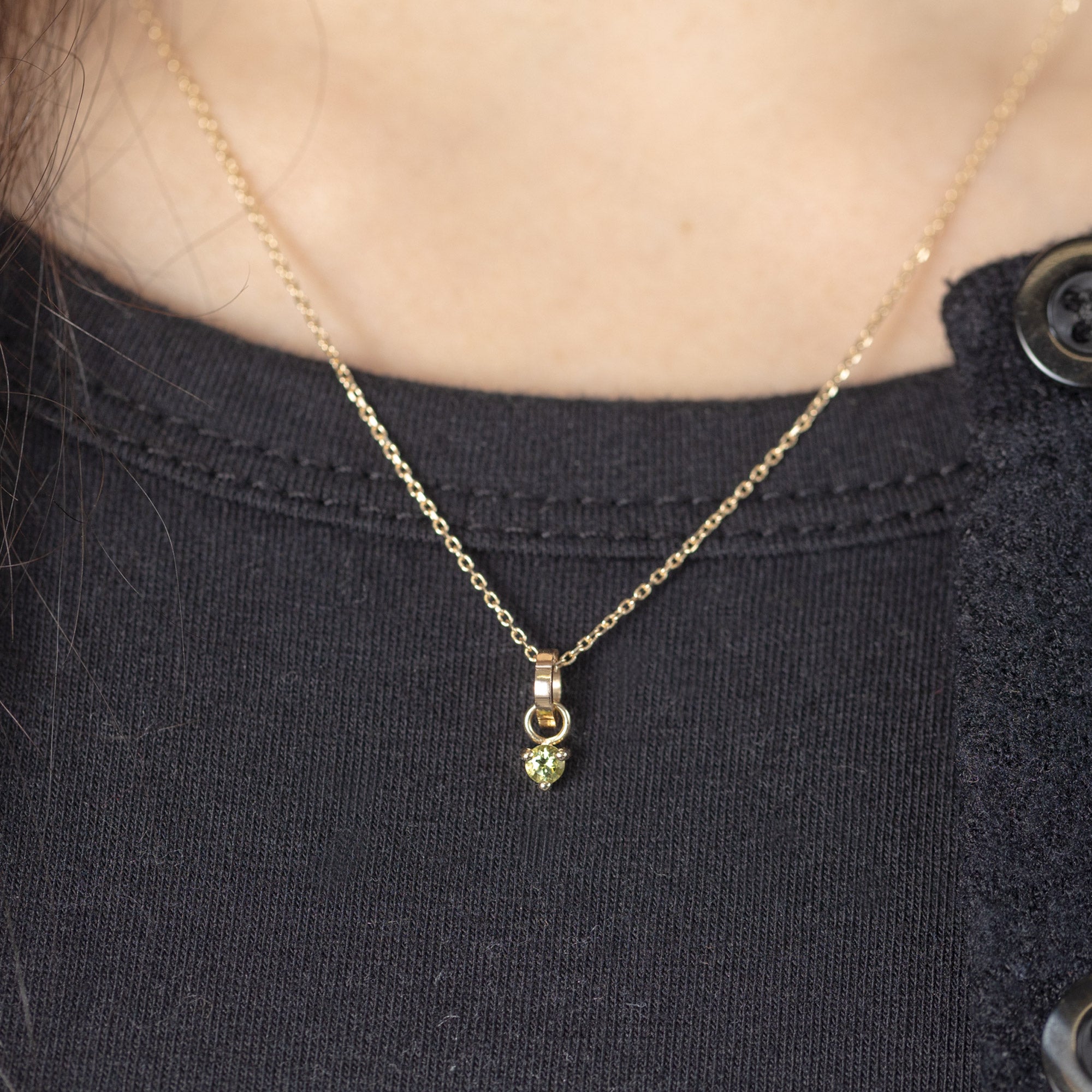 The Peridot Birthstone Charm in 10K Yellow Gold on Diamond Cut Cable Chain Necklace on Model