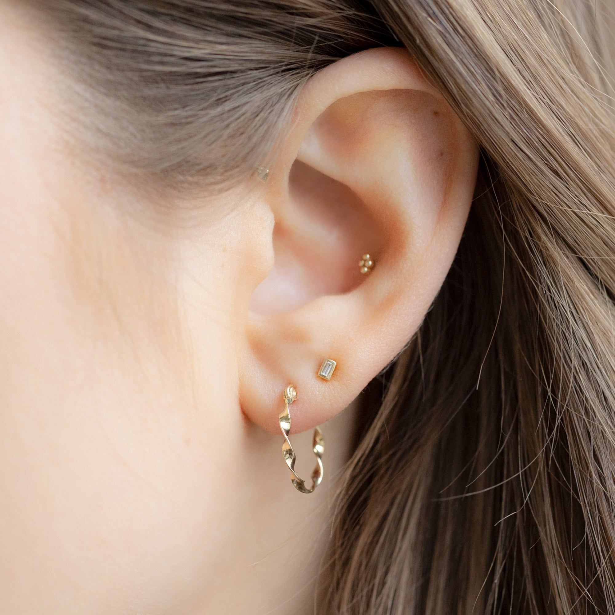 buy:the-ribbon-hoops-14k-yellow-gold,the-white-diamond-baguette-stud-earrings-14k-yellow-gold