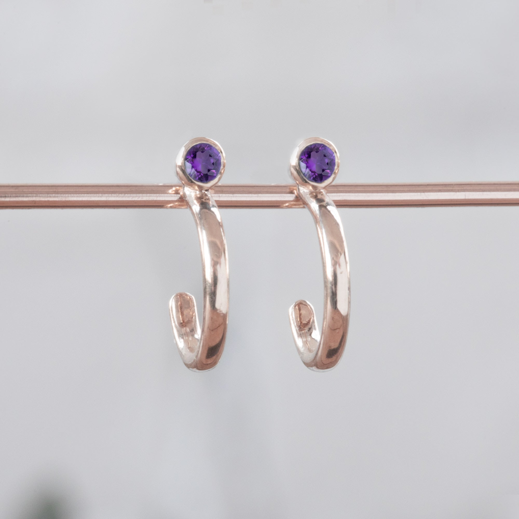Custom Amethyst Birthstone Hoop Earrings | 14K Rose Gold
displayed on bar
