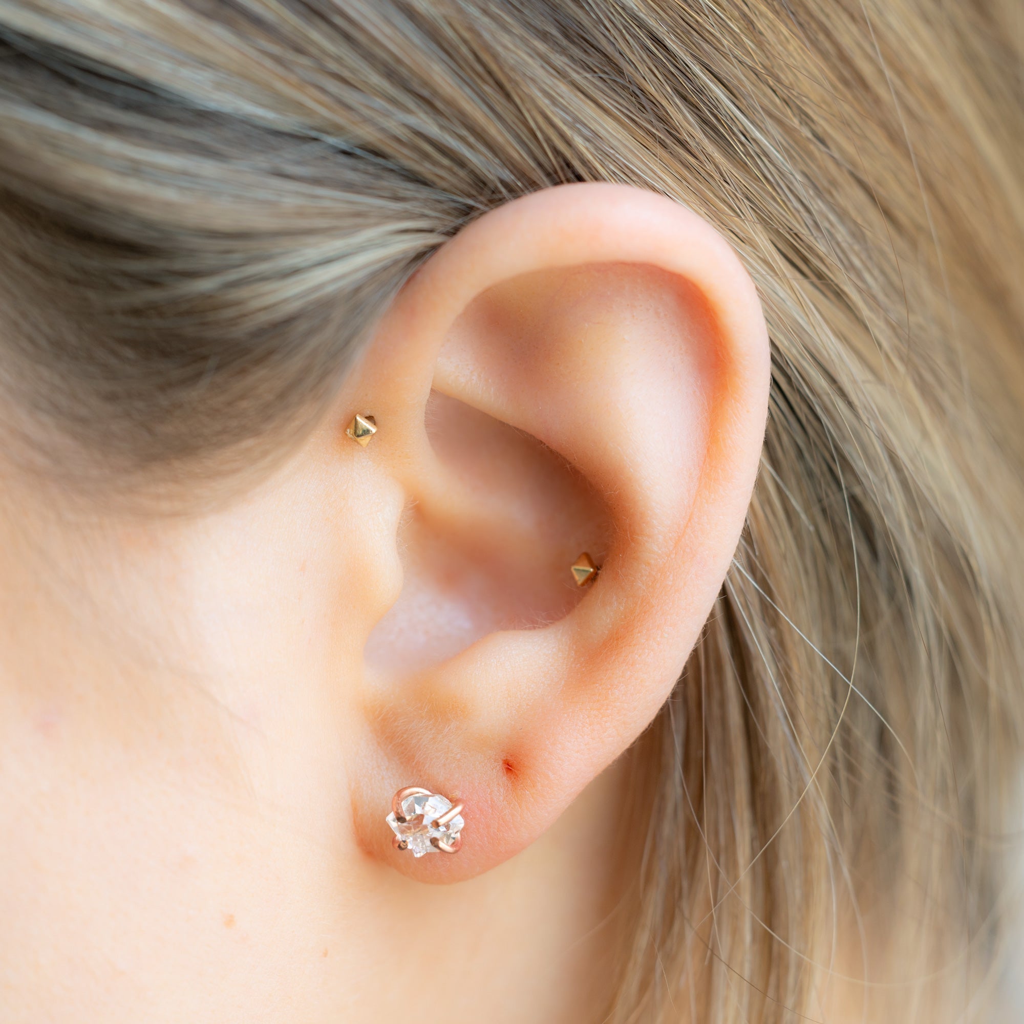The Herkimer Diamond Stud Earrings in Rose Gold Filled on Model
