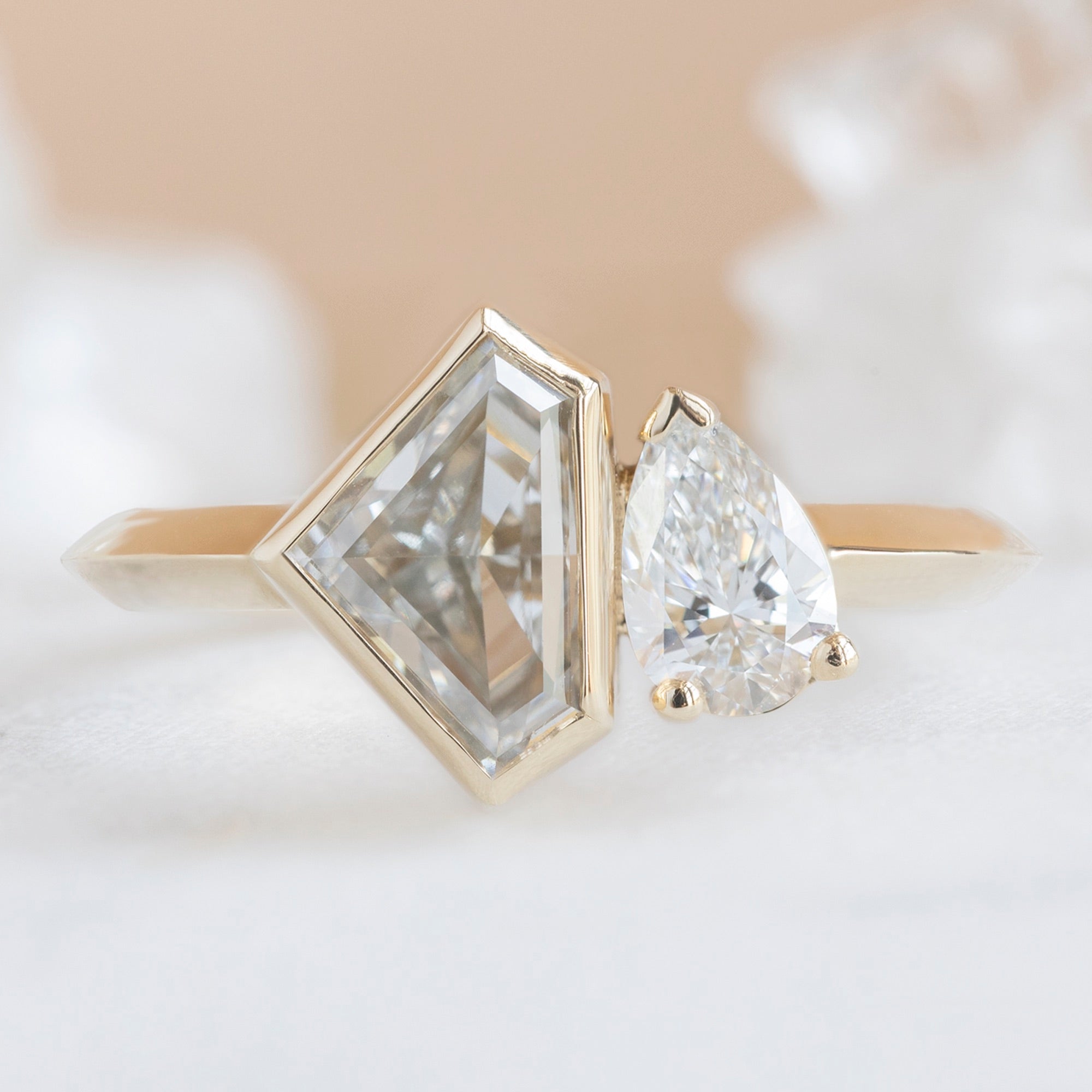 The You and Me Ring with a 1.36ct Lab Grown Shield White Diamond in 14K Yellow Gold on White Marble