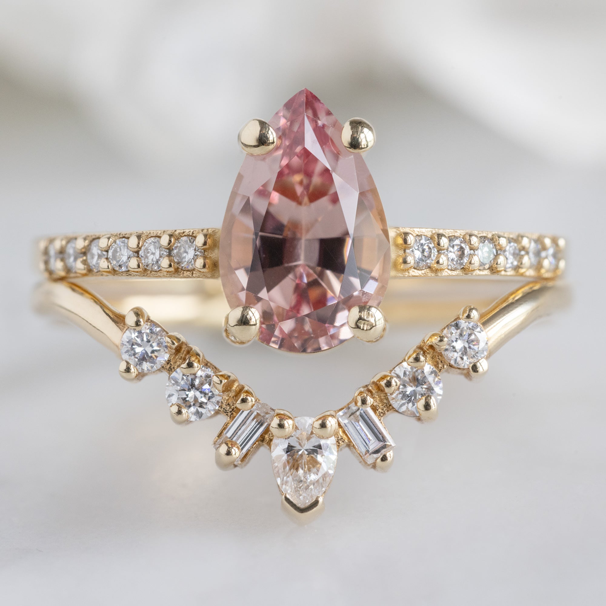 The Willow Ring with a 1.00ct Pear Garnet in 14K Yellow Gold Stacked with the Geometric White Diamond Sunburst Stacking Band