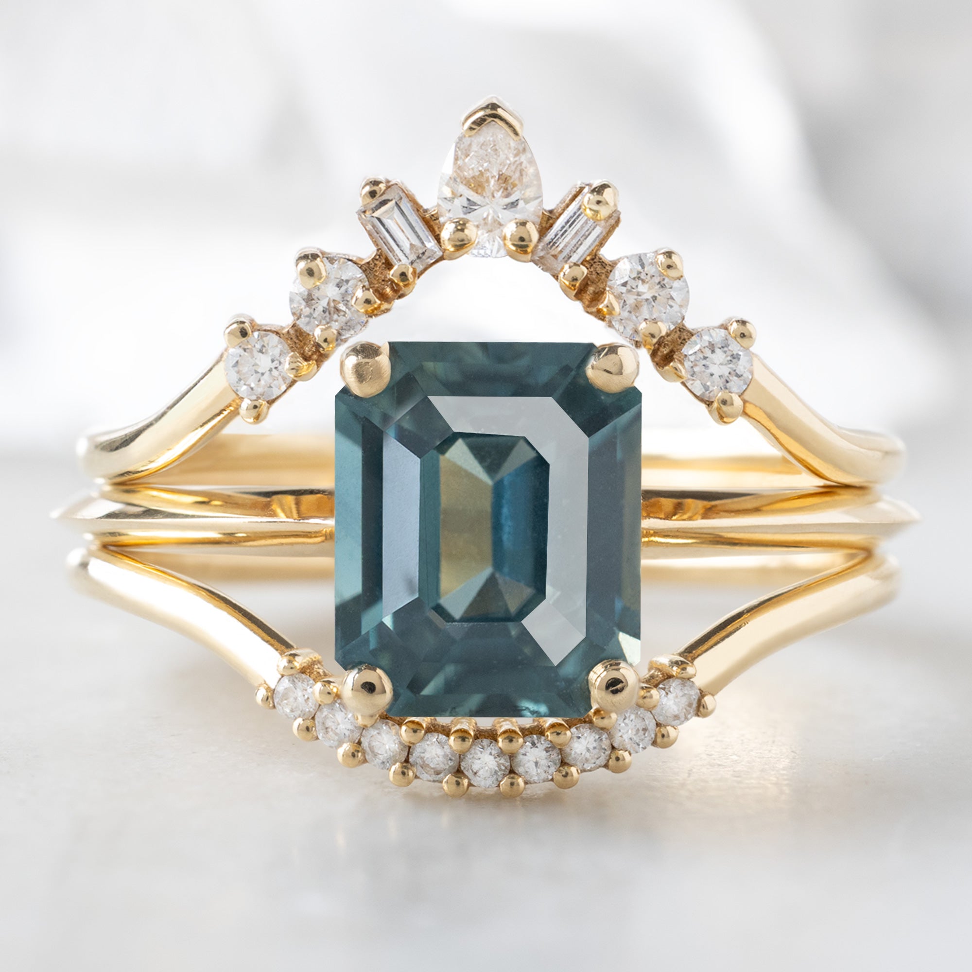 buy:geometric-white-diamond-sunburst-stacking-band-14k-or-18k-yellow-gold,the-bryn-ring-1-78ct-emerald-cut-sapphire-in-14k-yellow-gold,white-diamond-pave-arc-stacking-band-14k-or-18k-yellow-gold