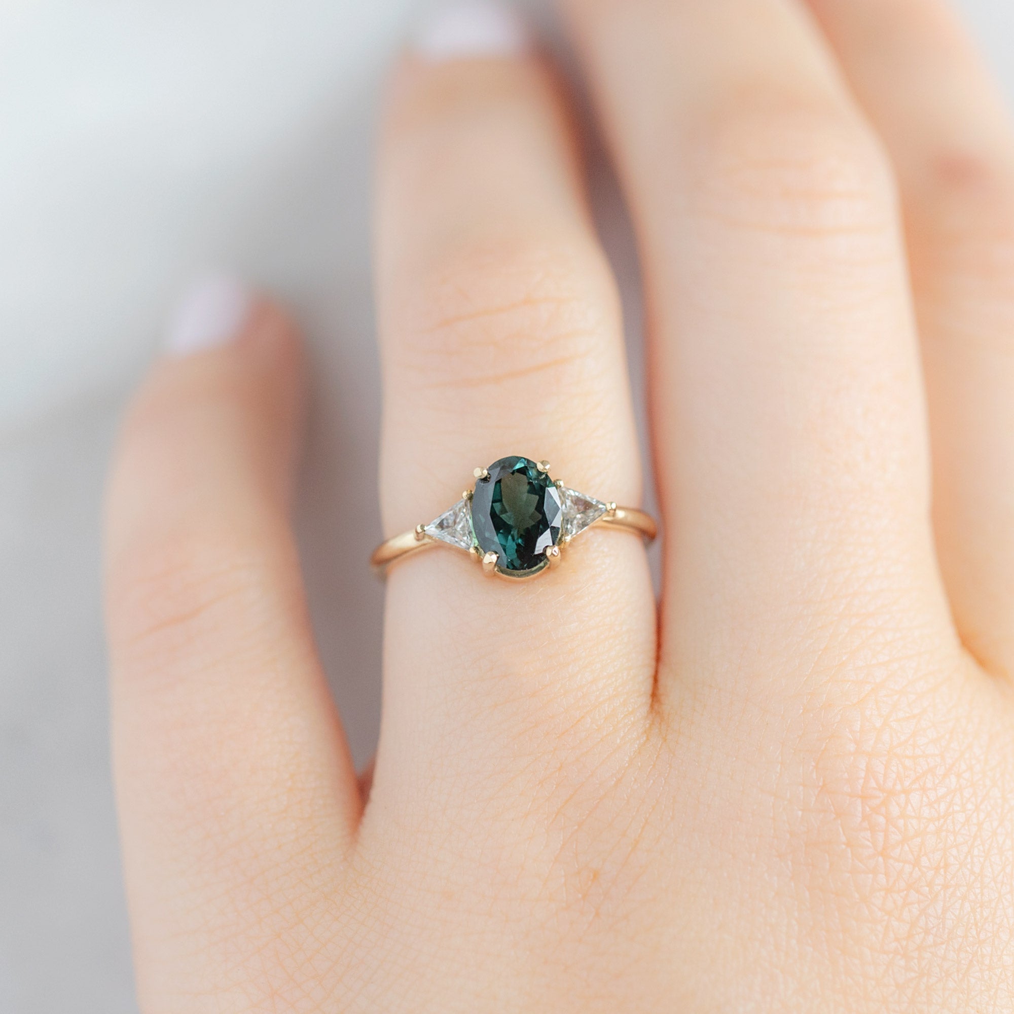 The Jade Ring with a 1.49ct Oval Cut Tourmaline in 14K Yellow Gold on Marble