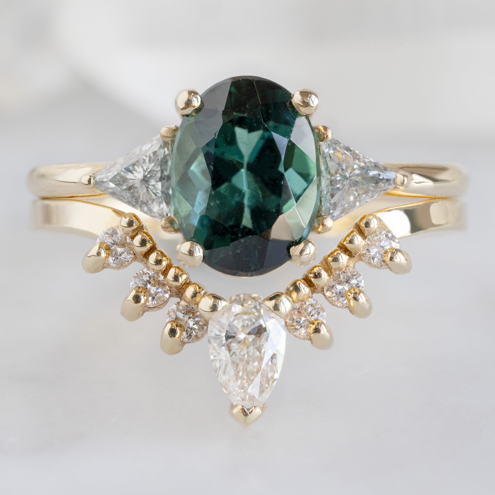 The Jade Ring with a 1.49ct Oval Cut Tourmaline in 14K Yellow Gold Stacked with the White Diamond Sunburst Stacking Band
