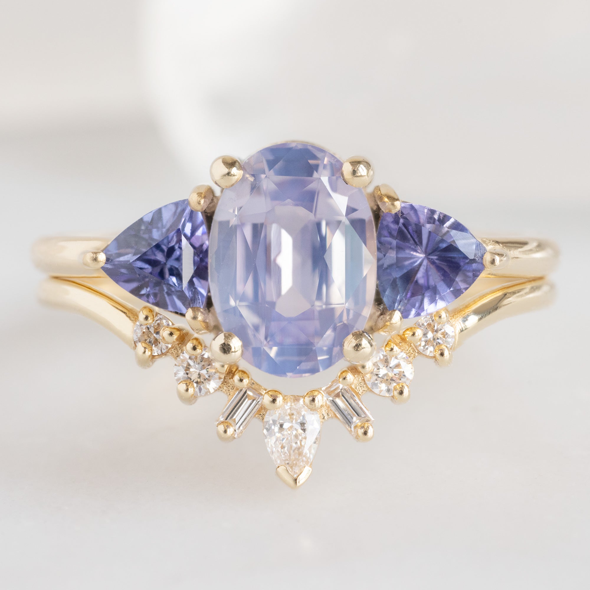 buy:the-watercolor-jade-ring-1-81ct-oval-cut-purple-sapphire-in-14k-yellow-gold,geometric-white-diamond-sunburst-stacking-band-14k-or-18k-yellow-gold