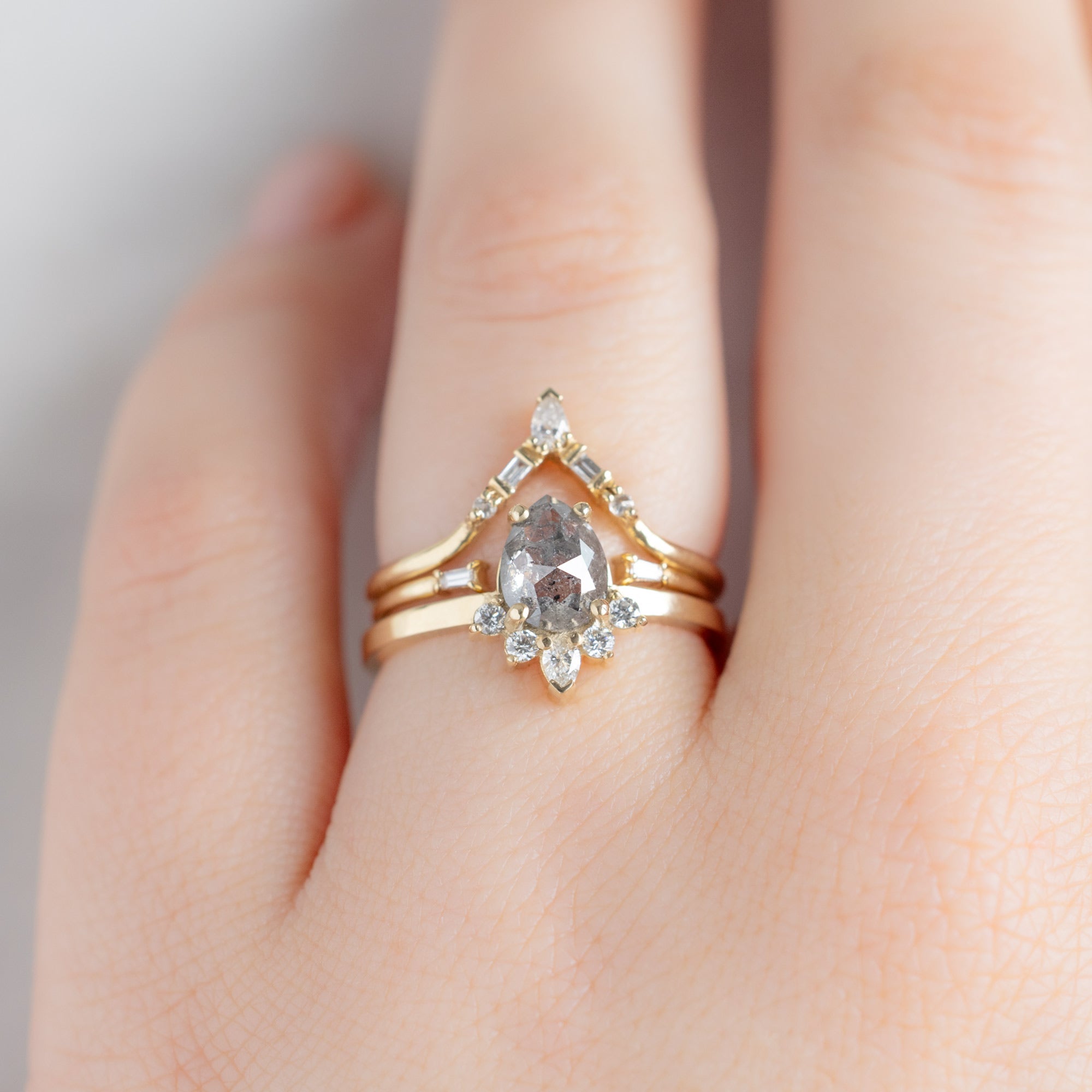 buy:white-diamond-tiara-stacking-band-14k-or-18k-yellow-gold,open-cuff-baguette-white-diamond-stacking-band-14k-or-18k-yellow-gold,the-aster-ring-0-95ct-pear-salt-and-pepper-diamond-in-14k-yellow-gold