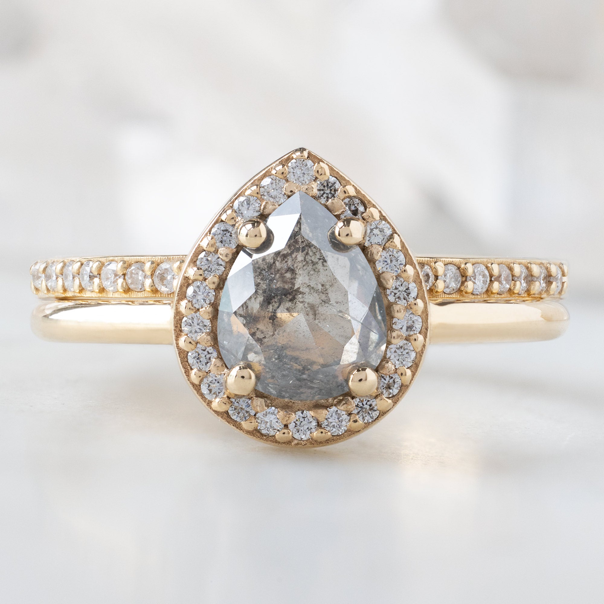 The Dahlia Ring with a 0.90ct Pear Grey Diamond in 14K Yellow Gold Stacked with the Open Cuff White Pavé Diamond Stacking Band