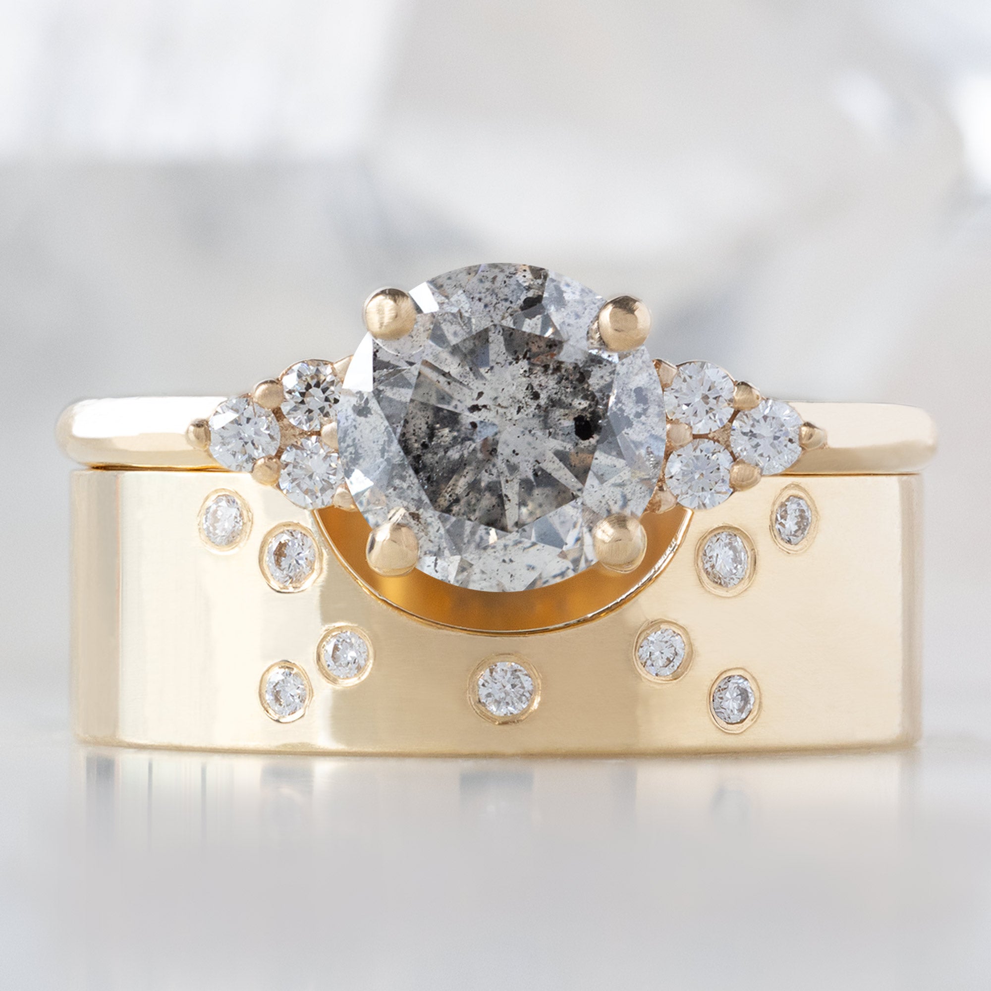 The Ivy Ring with a 1.01ct Round Salt and Pepper Diamond in 14K Yellow Gold Stacked with the Constellation Cut-Out Stacking Band