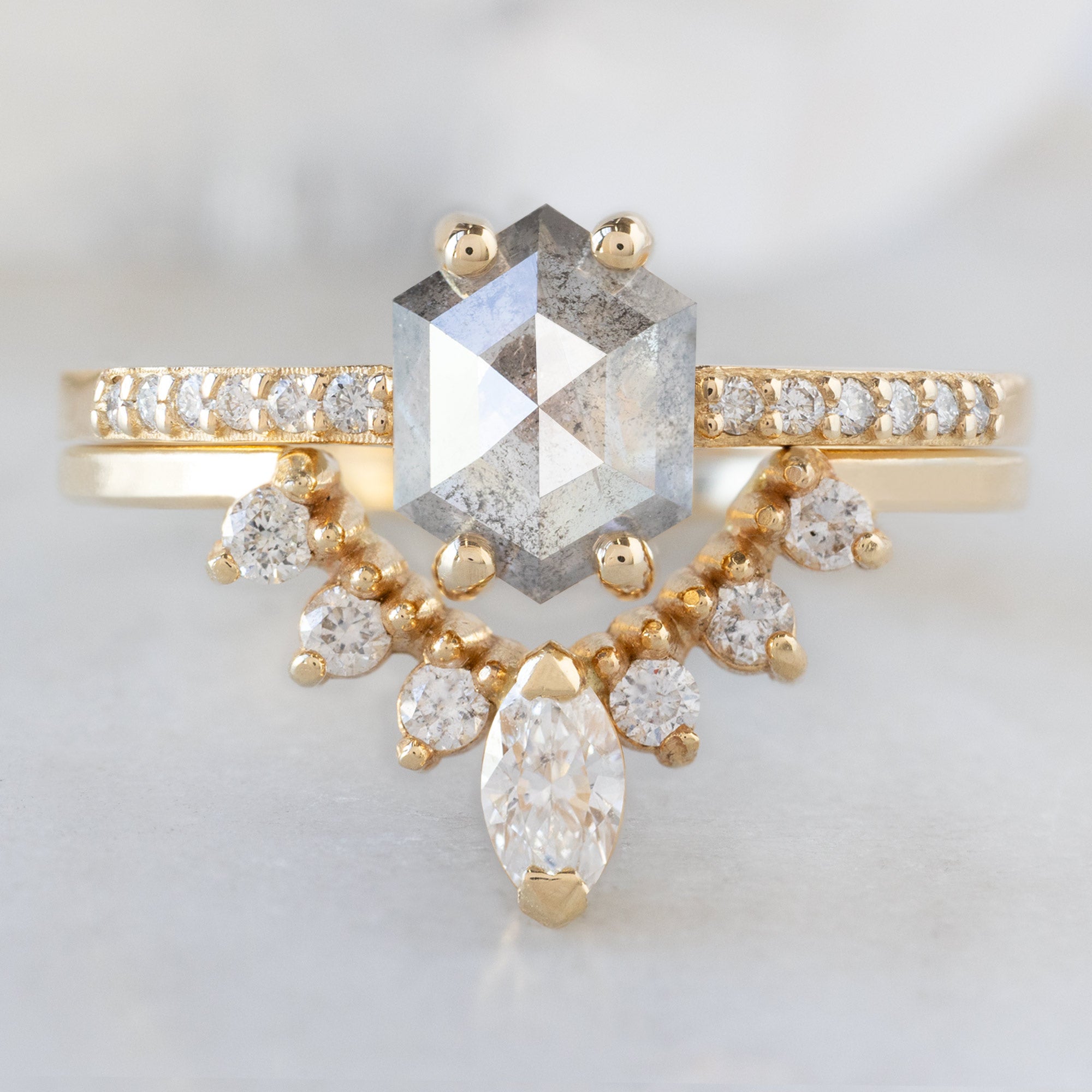 The Willow Ring with a .99ct Hexagon Salt and Pepper Diamond in 14K Yellow Gold Stacked with the Marquise White Diamond Sunburst Stacking Band
