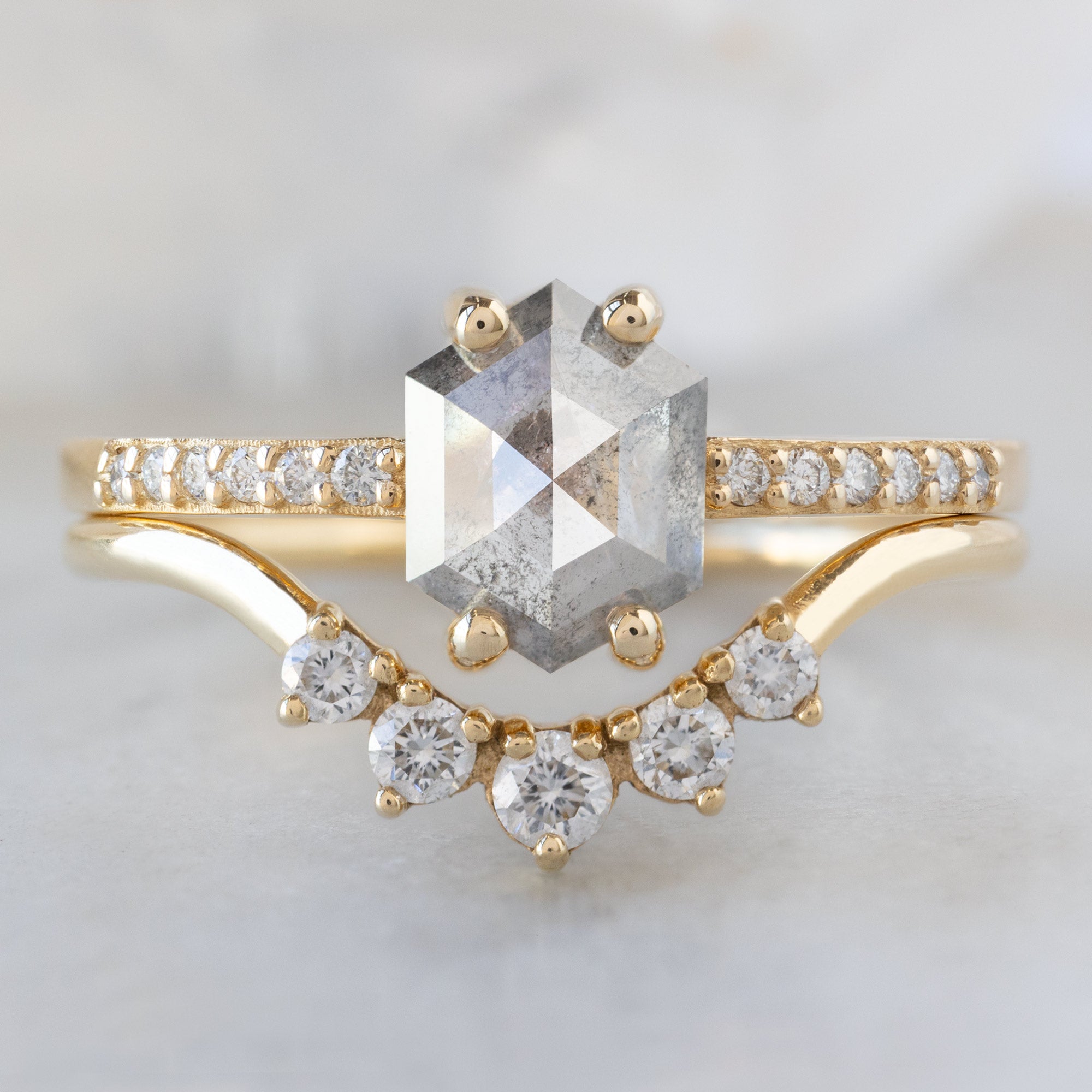 The Willow Ring with a .99ct Hexagon Salt and Pepper Diamond in 14K Yellow Gold Stacked with the Round White Diamond Sunburst Stacking Band