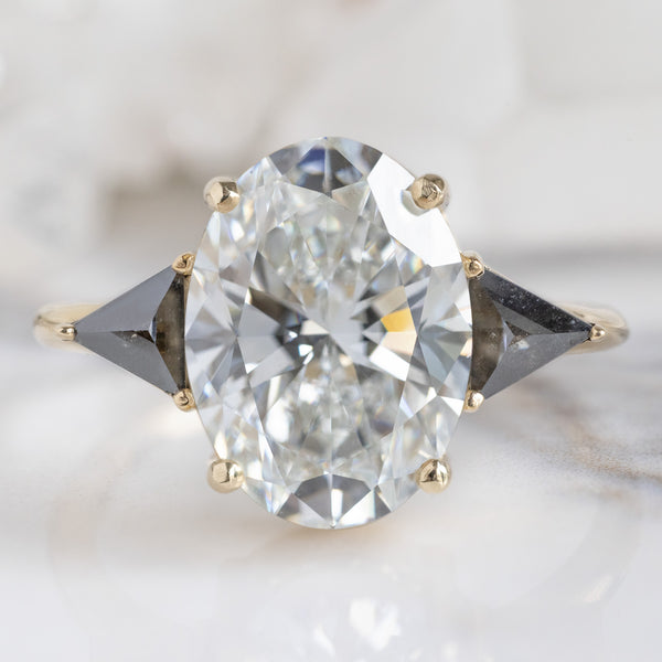 The Jade Ring with a 3.39ct Oval Lab Grown White Diamond in 14K Yellow Gold on White Marble