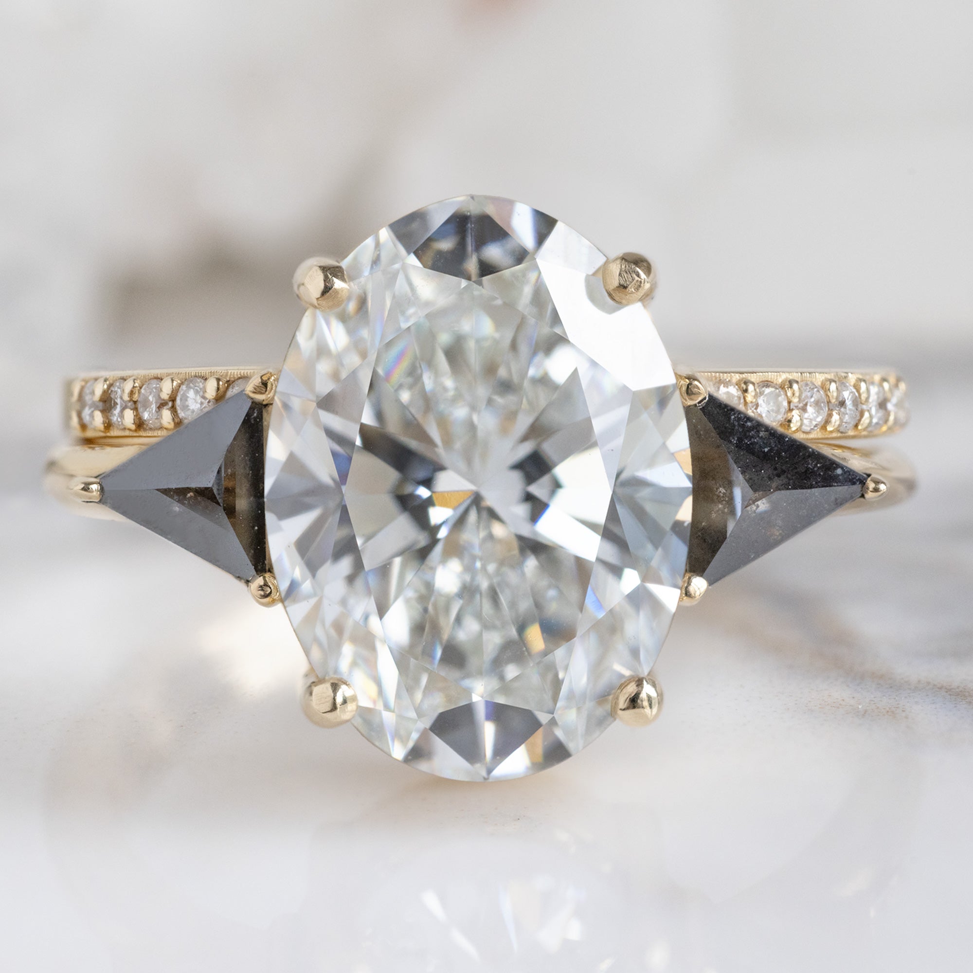The Jade Ring with a 3.39ct Oval Lab Grown White Diamond in 14K Yellow Gold Stacked with the White Diamond Pavé Wedding Band