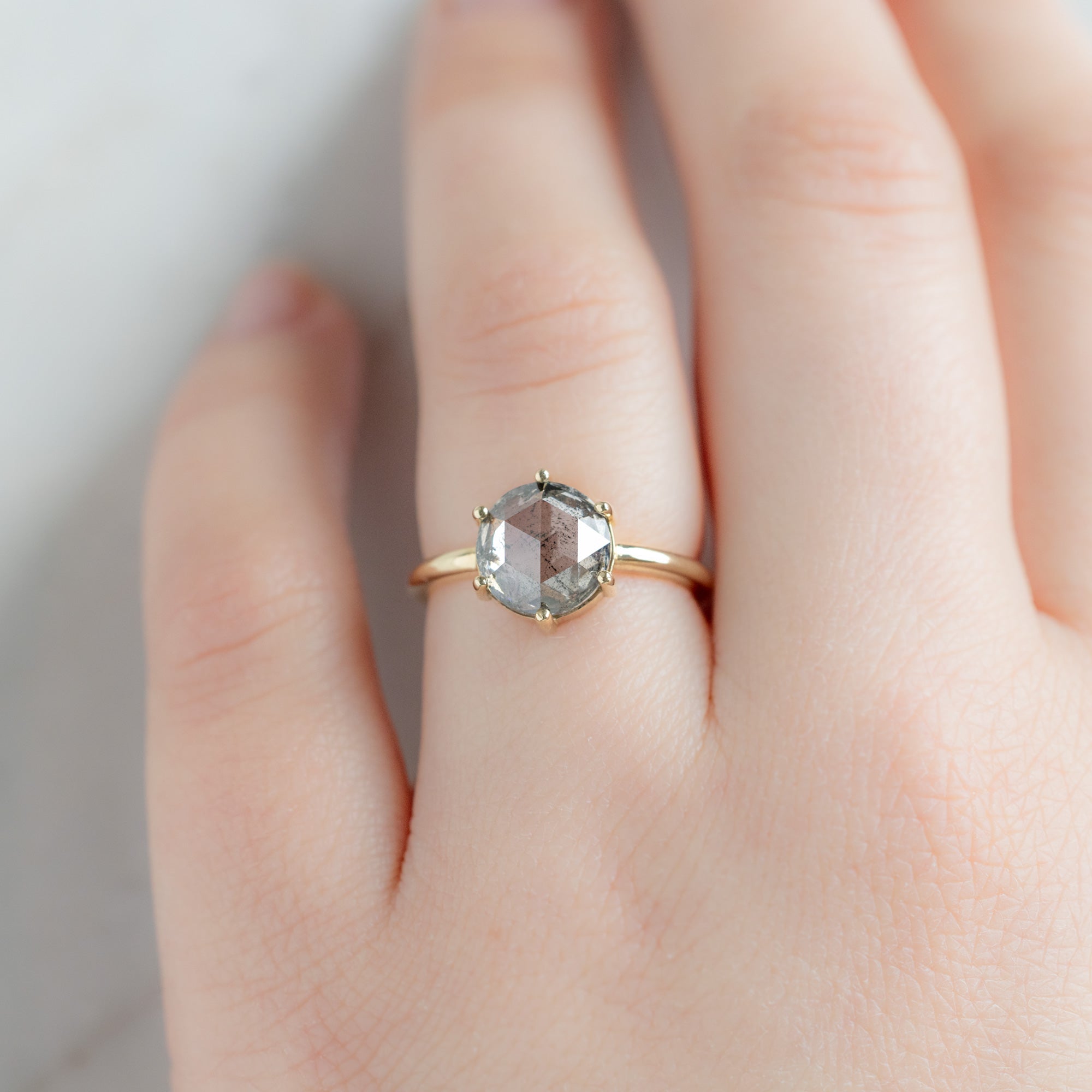 The Rose Ring with a 2.55ct Round Lab Grown Salt and Pepper Diamond in 14K Yellow Gold on Model
