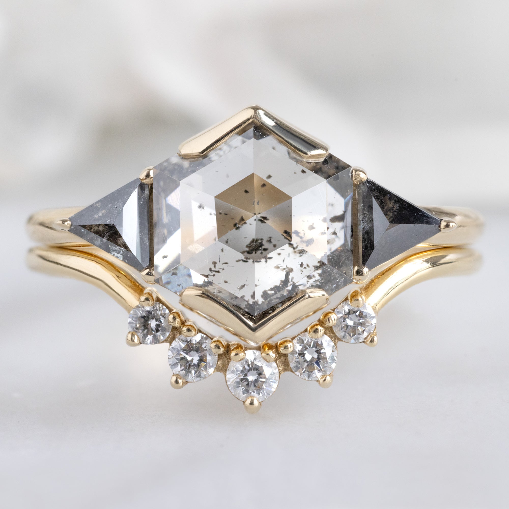 The Jade Ring with a 1.72ct Hexagon Lab Grown Salt and Pepper Diamond in 14K Yellow Gold Stacked with the Round White Diamond Sunburst Stacking Band