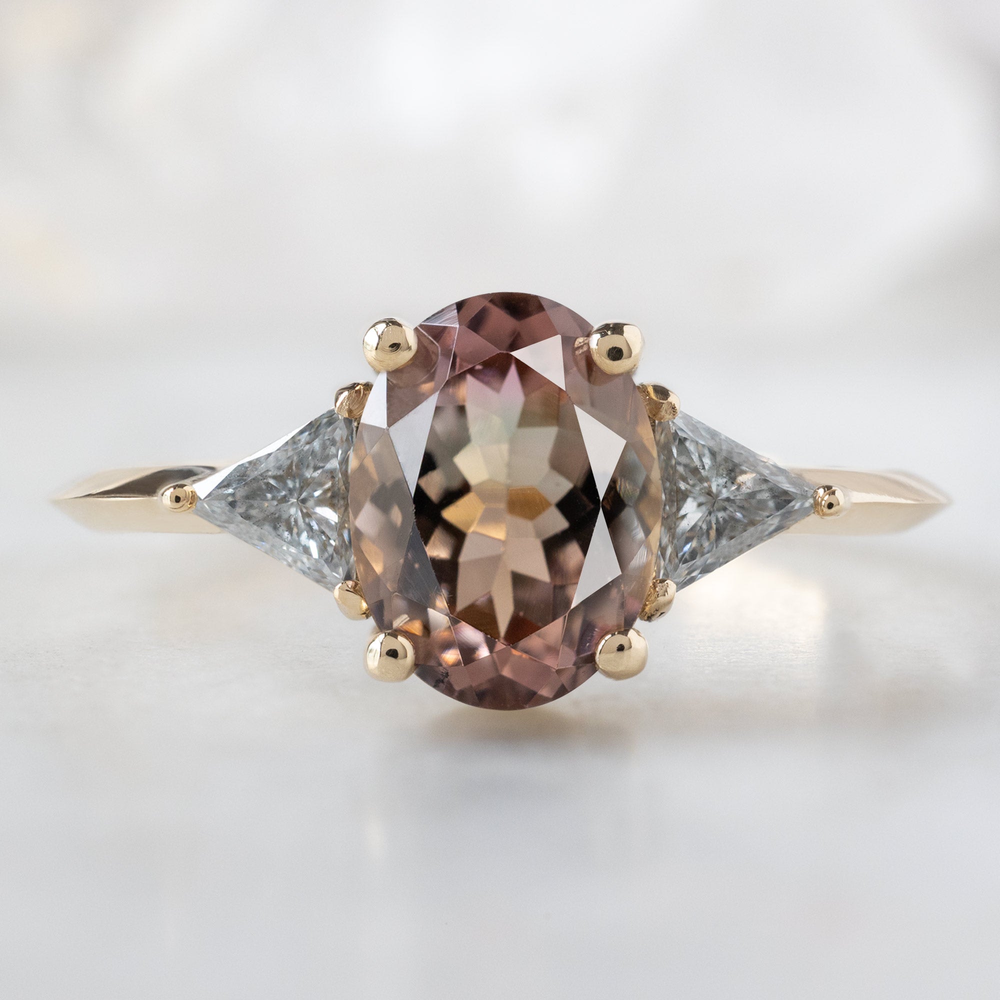 The Jade Ring with a 1.26ct Oval Bicolor Tourmaline in 14K Yellow Gold on White Marble