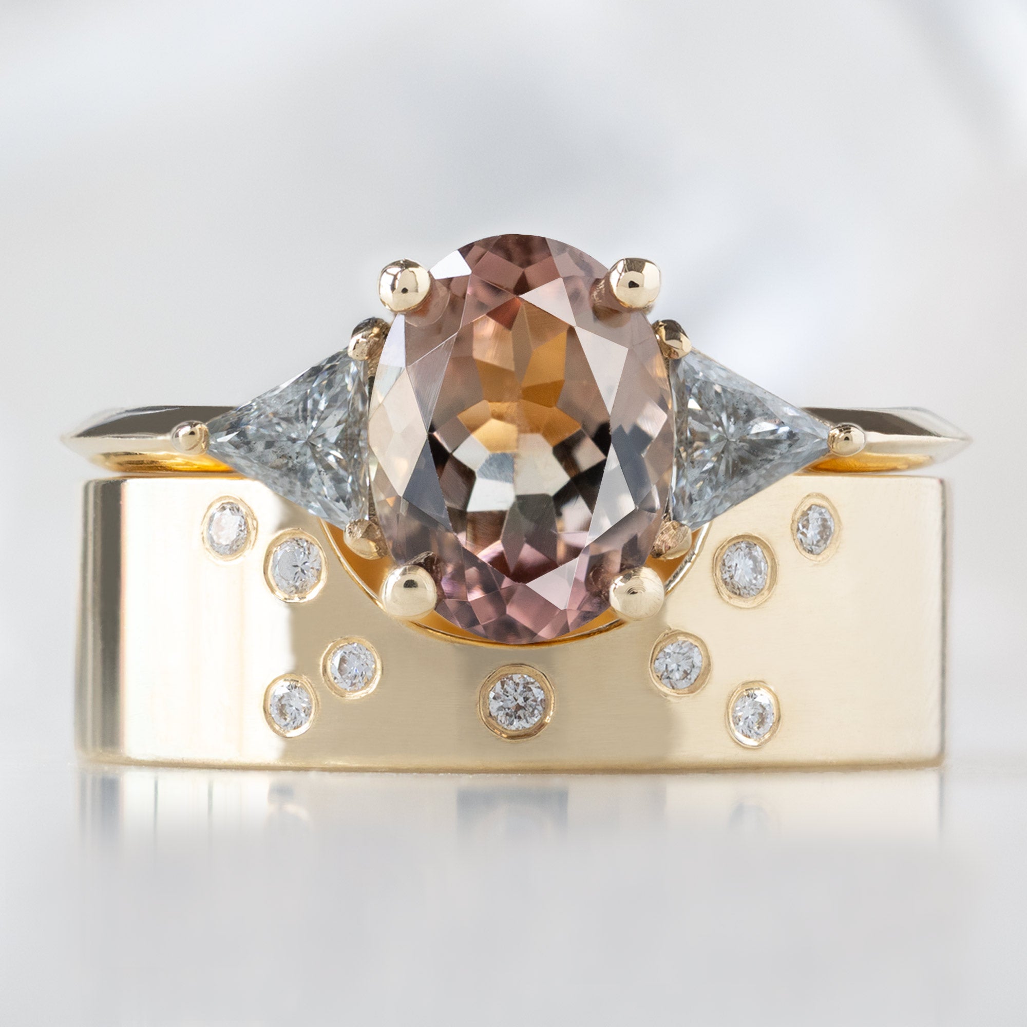 The Jade Ring with a 1.26ct Oval Bicolor Tourmaline in 14K Yellow Gold Stacked with the Constellation Arc Stacking Band