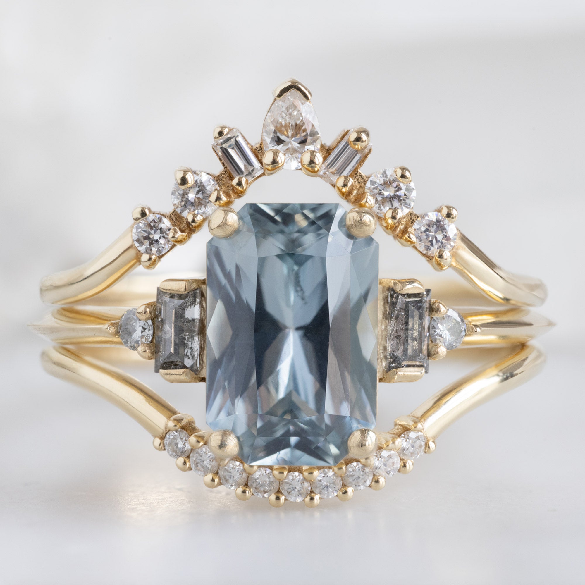 buy:geometric-white-diamond-sunburst-stacking-band-14k-or-18k-yellow-gold,the-primrose-ring-2-00ct-emerald-cut-blue-sapphire-in-14k-yellow-gold,white-diamond-pave-arc-stacking-band-14k-or-18k-yellow-gold