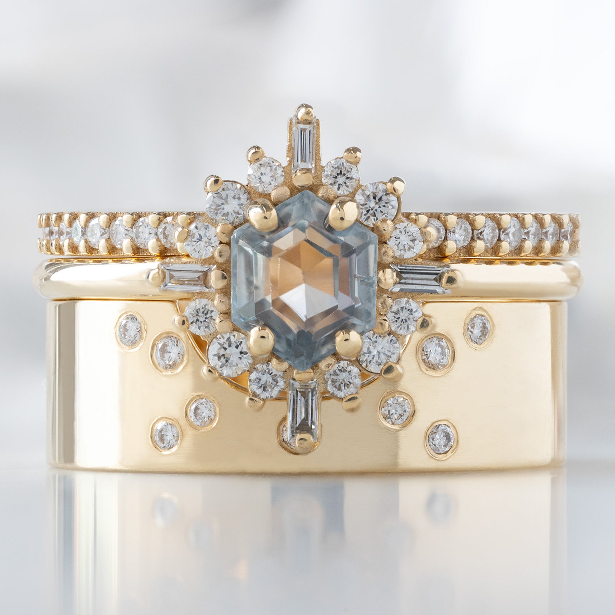 buy:the-white-diamond-pave-wedding-band-14k-or-18k-yellow-gold,the-compass-ring-0-75ct-hexagon-grey-sapphire-in-14k-yellow-gold,constellation-cut-out-stacking-band-arc-cut-out-in-14k-yellow-gold