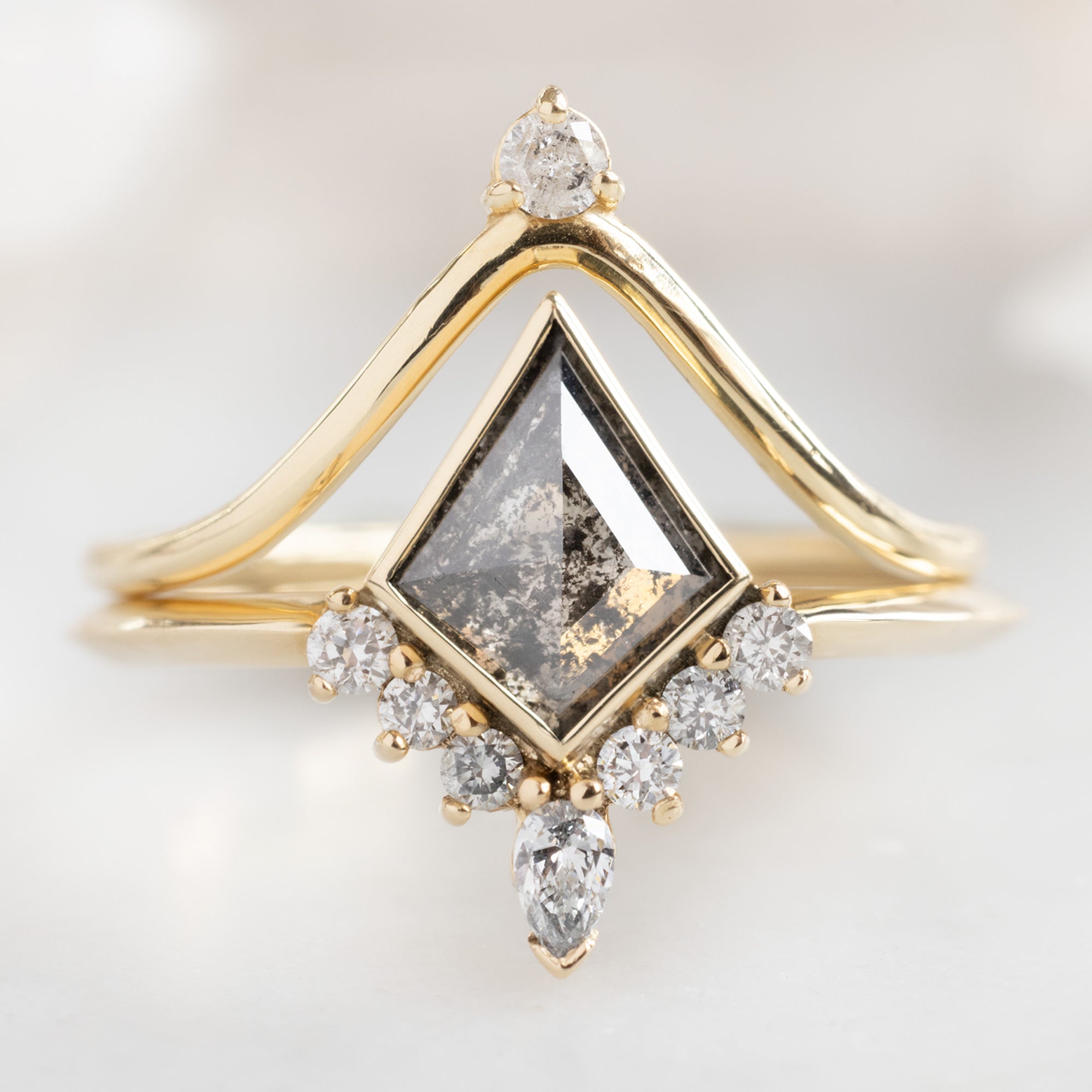 The Aster Ring with a Salt and Pepper Kite Diamond in 14K Yellow Gold Stacked with the White Diamond Crown Stacking Band