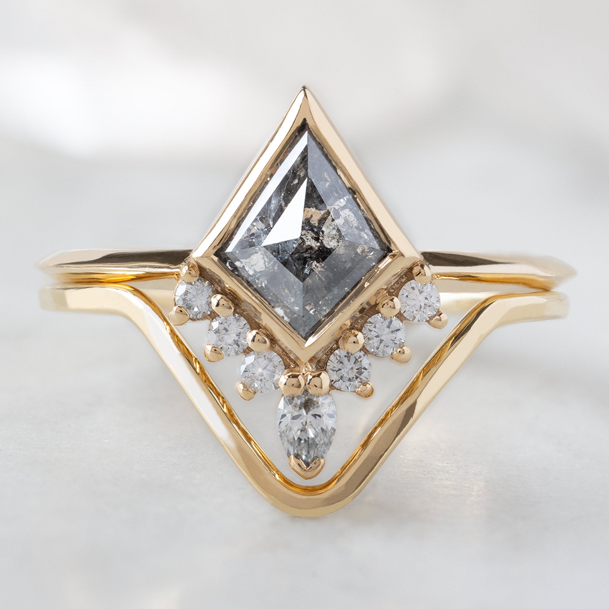 The Aster Ring with a Salt and Pepper Kite Diamond in 14K Yellow Gold Stacked with the Gold Peak Stacking Band