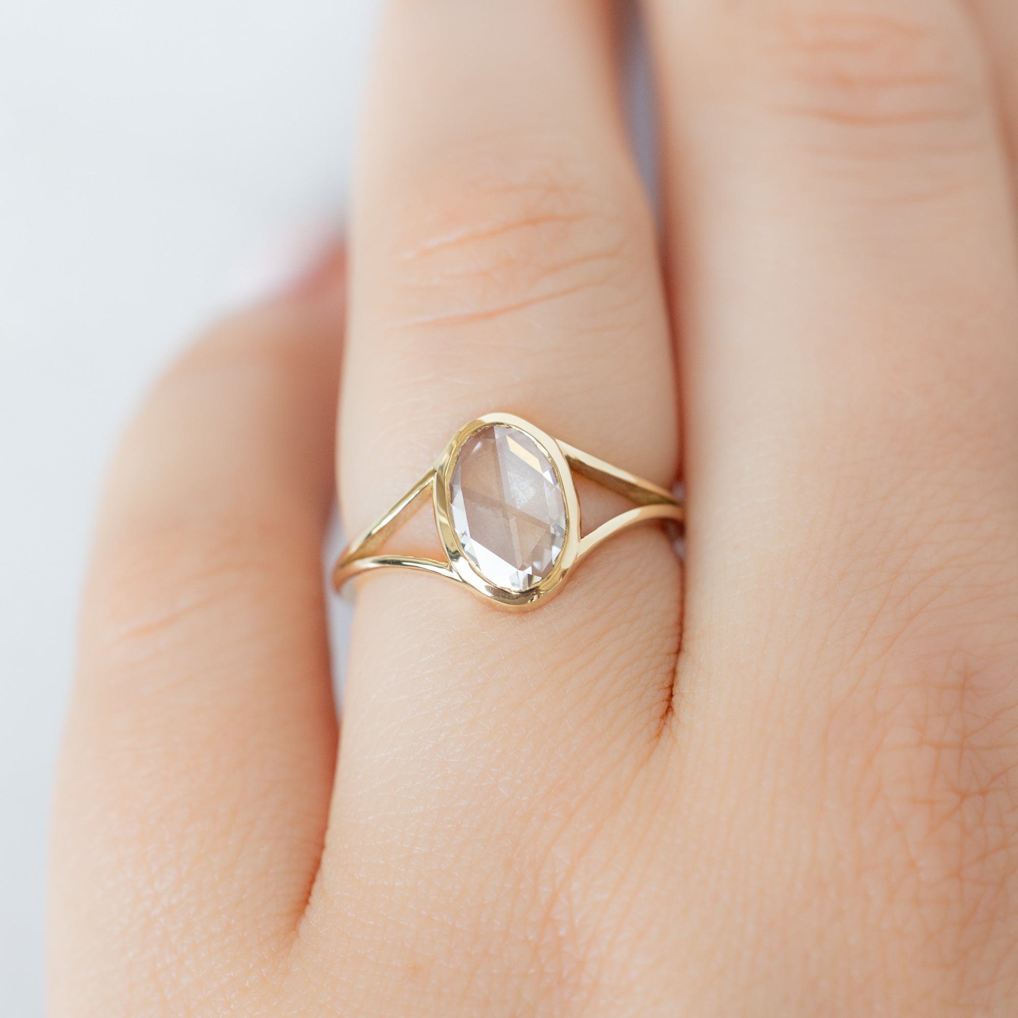 The Magnolia Ring with a 1.26ct Oval Lab Grown White Diamond in 14K Yellow Gold on Model