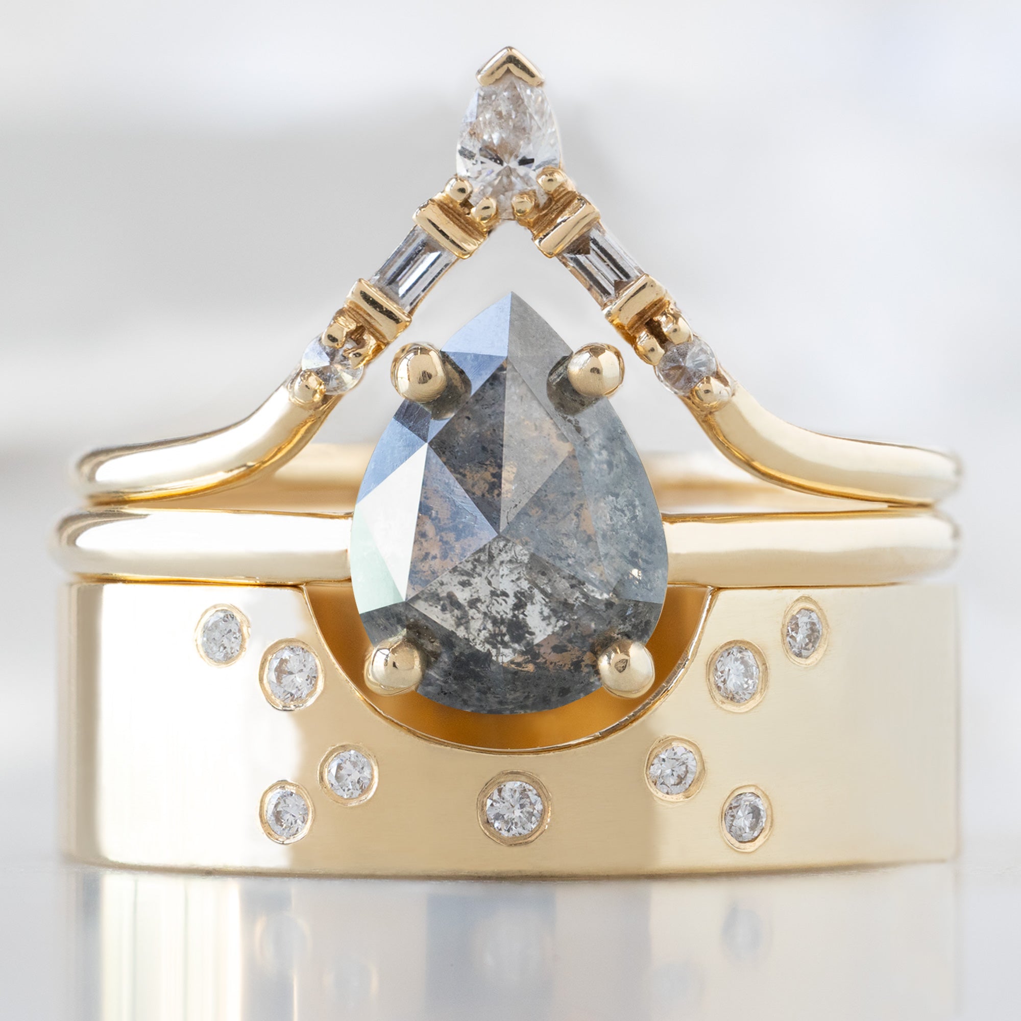 buy:white-diamond-tiara-stacking-band-14k-or-18k-yellow-gold,the-bryn-ring-1-25ct-pear-salt-and-pepper-diamond-in-14k-yellow-gold,constellation-cut-out-stacking-band-arc-cut-out-in-14k-yellow-gold
