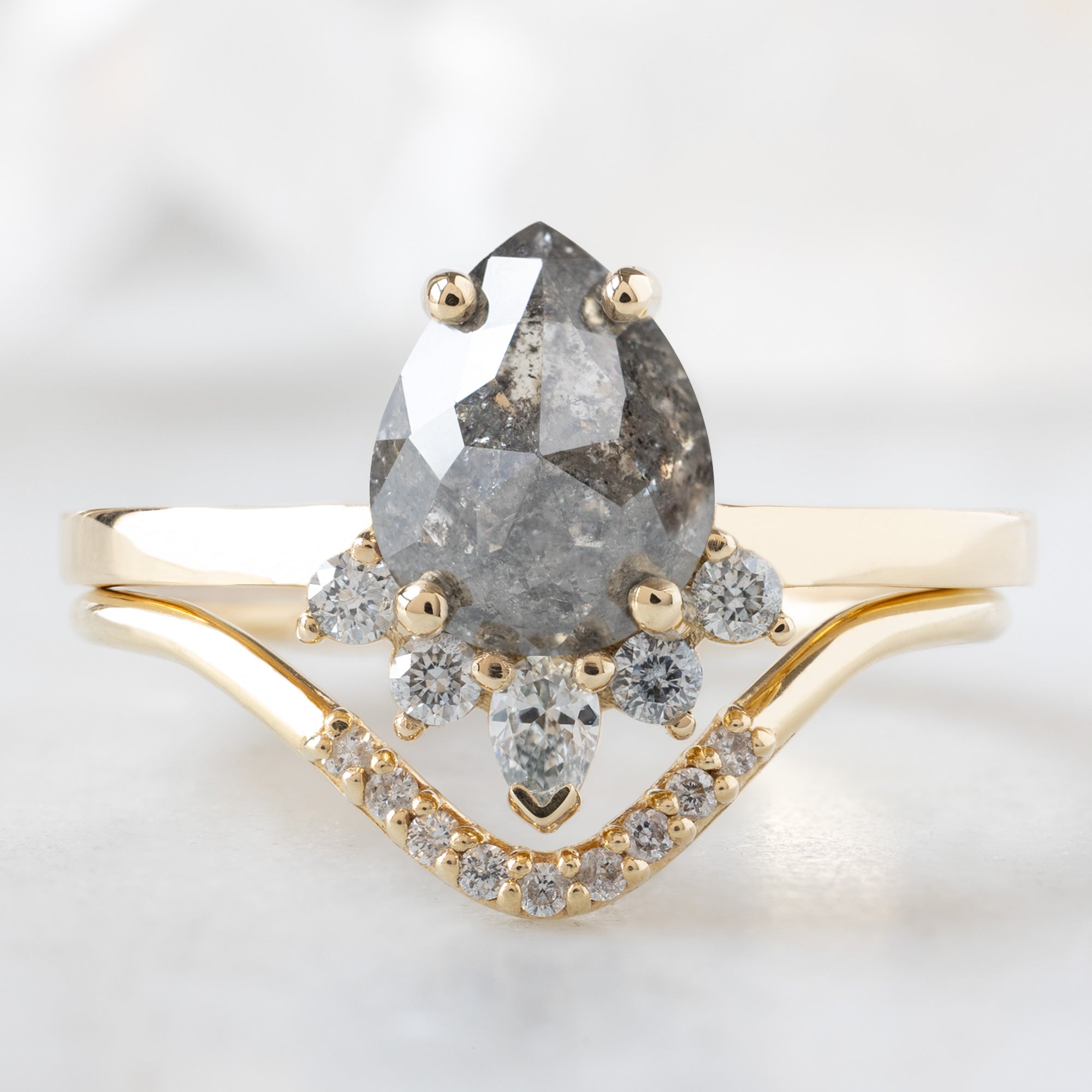 The Aster Ring with a 1.31ct Pear Salt and Pepper Diamond in 14K Yellow Gold Stacked with the White Diamond Pavé Peak Stacking Band