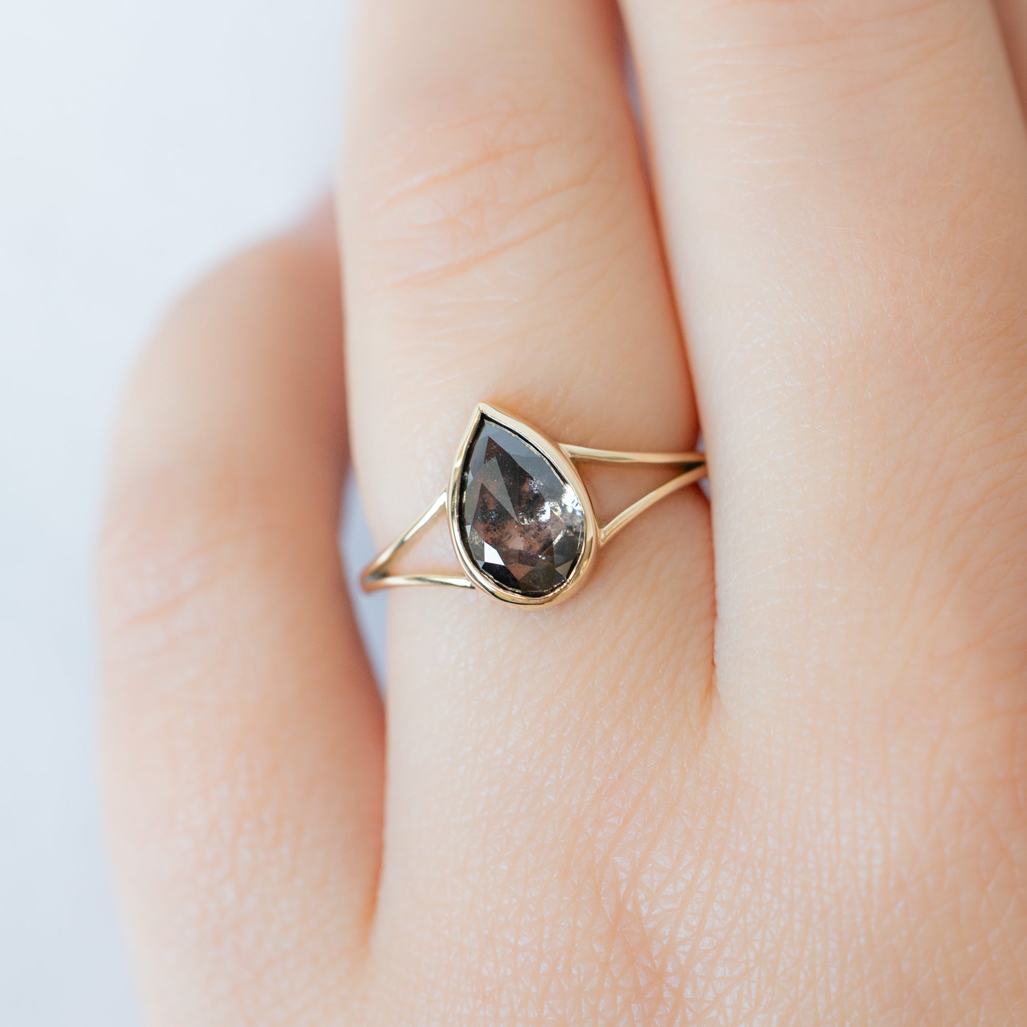 The Magnolia Ring with a 1.44ct Lab Grown Salt and Pepper Pear Diamond in 14K Yellow Gold  on Model