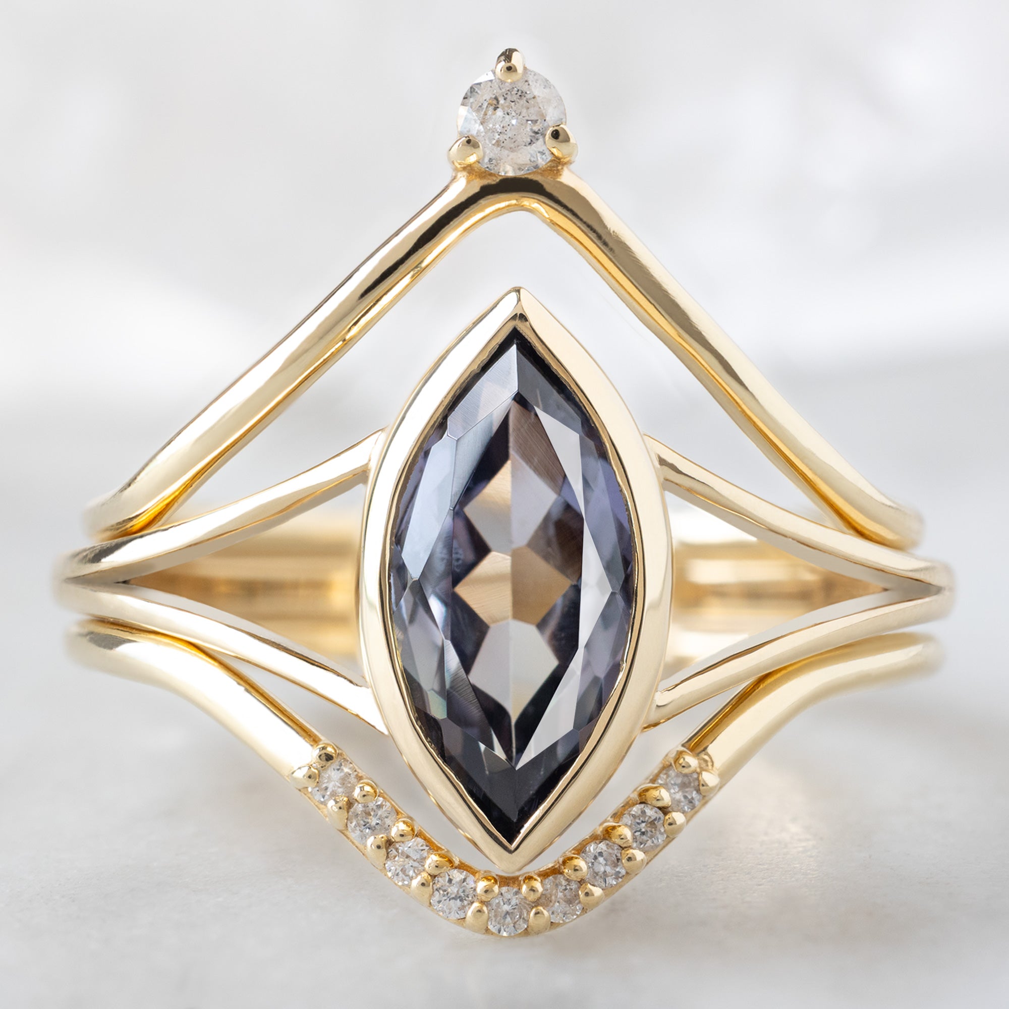 buy:white-diamond-crown-stacking-band-14k-or-18k-yellow-gold,the-magnolia-ring-1-63ct-marquise-tanzanite-in-14k-yellow-gold,white-diamond-pave-peak-stacking-band-14k-or-18k-yellow-gold