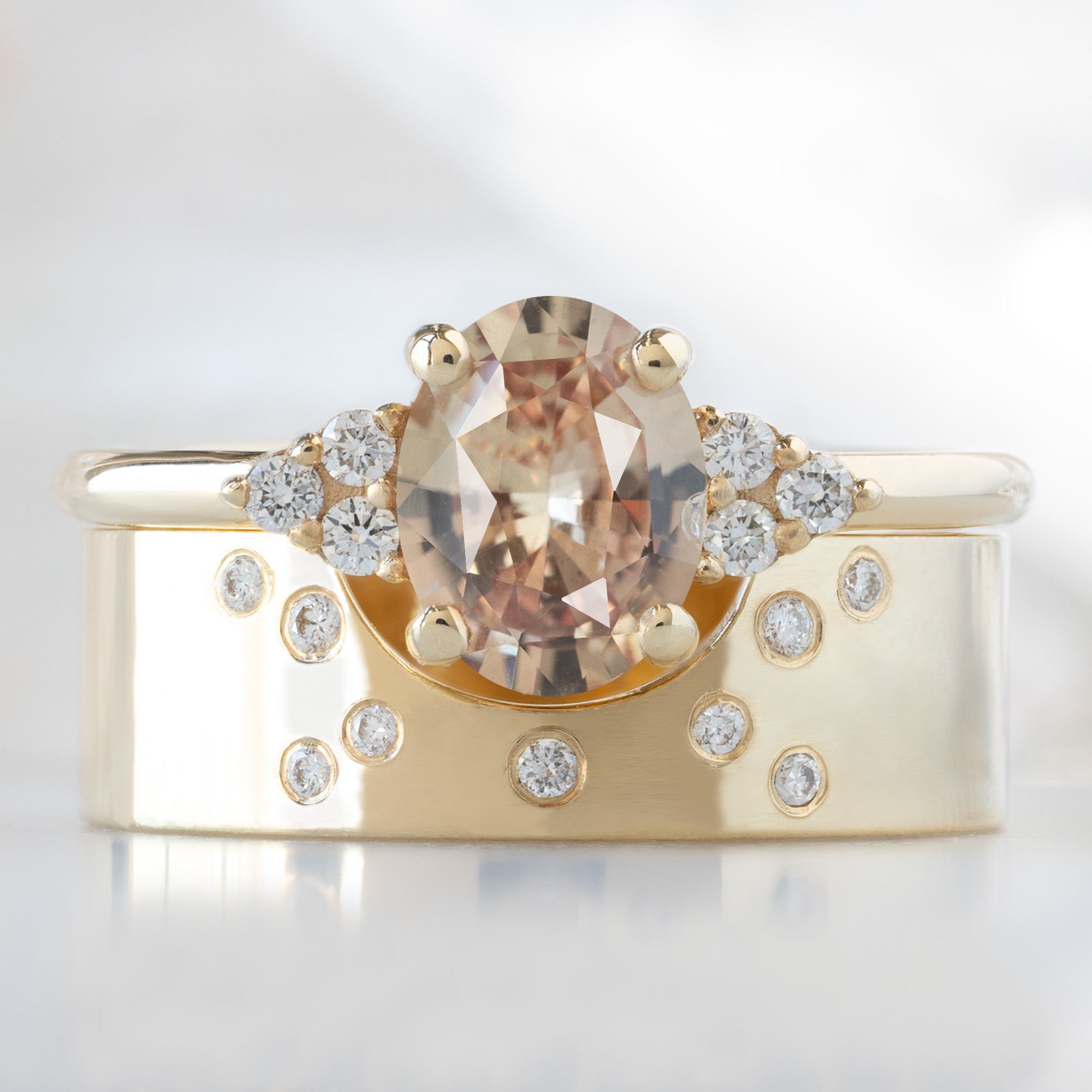 buy:the-ivy-ring-1-13ct-oval-peach-sapphire-in-14k-yellow-gold,constellation-cut-out-stacking-band-arc-cut-out-in-14k-yellow-gold