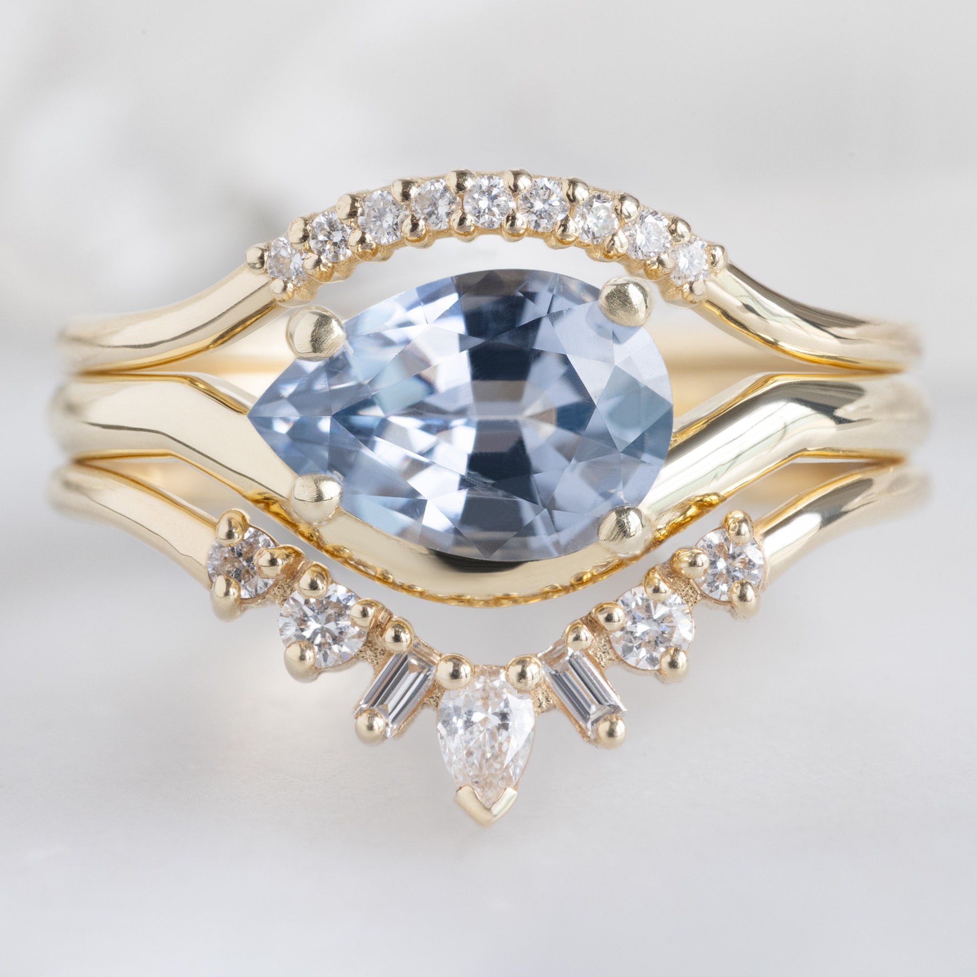 buy:white-diamond-pave-arc-stacking-band-14k-or-18k-yellow-gold,the-wave-ring-1-29ct-pear-lavender-spinel-in-14k-yellow-gold,geometric-white-diamond-sunburst-stacking-band-14k-or-18k-yellow-gold