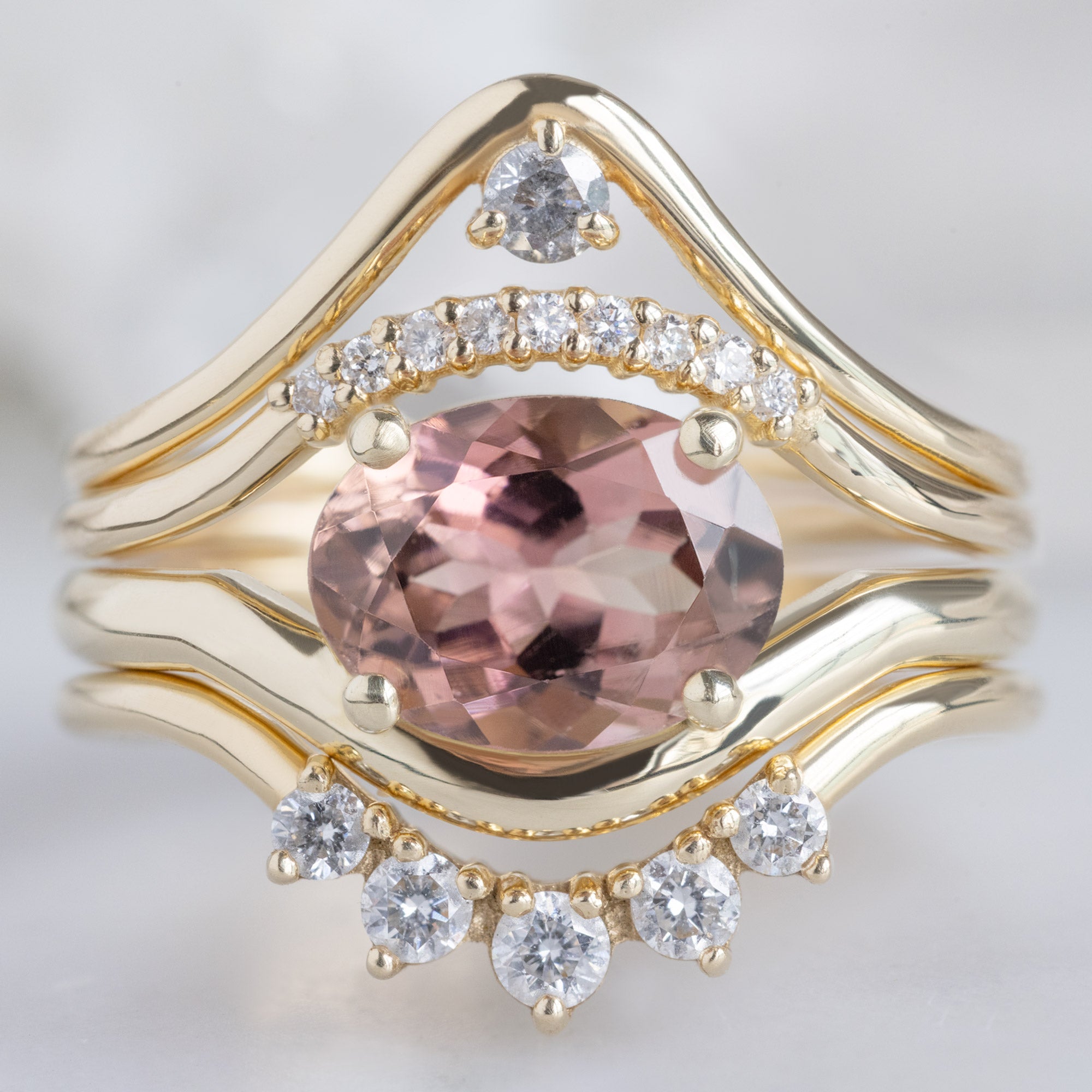 buy:peak-salt-and-pepper-diamond-stacking-band-14k-or-18k-yellow-gold,white-diamond-pave-arc-stacking-band-14k-or-18k-yellow-gold,the-wave-ring-1-35ct-oval-pink-tourmaline-in-14k-yellow-gold,round-white-diamond-sunburst-stacking-band-14k-or-18k-yellow-gold