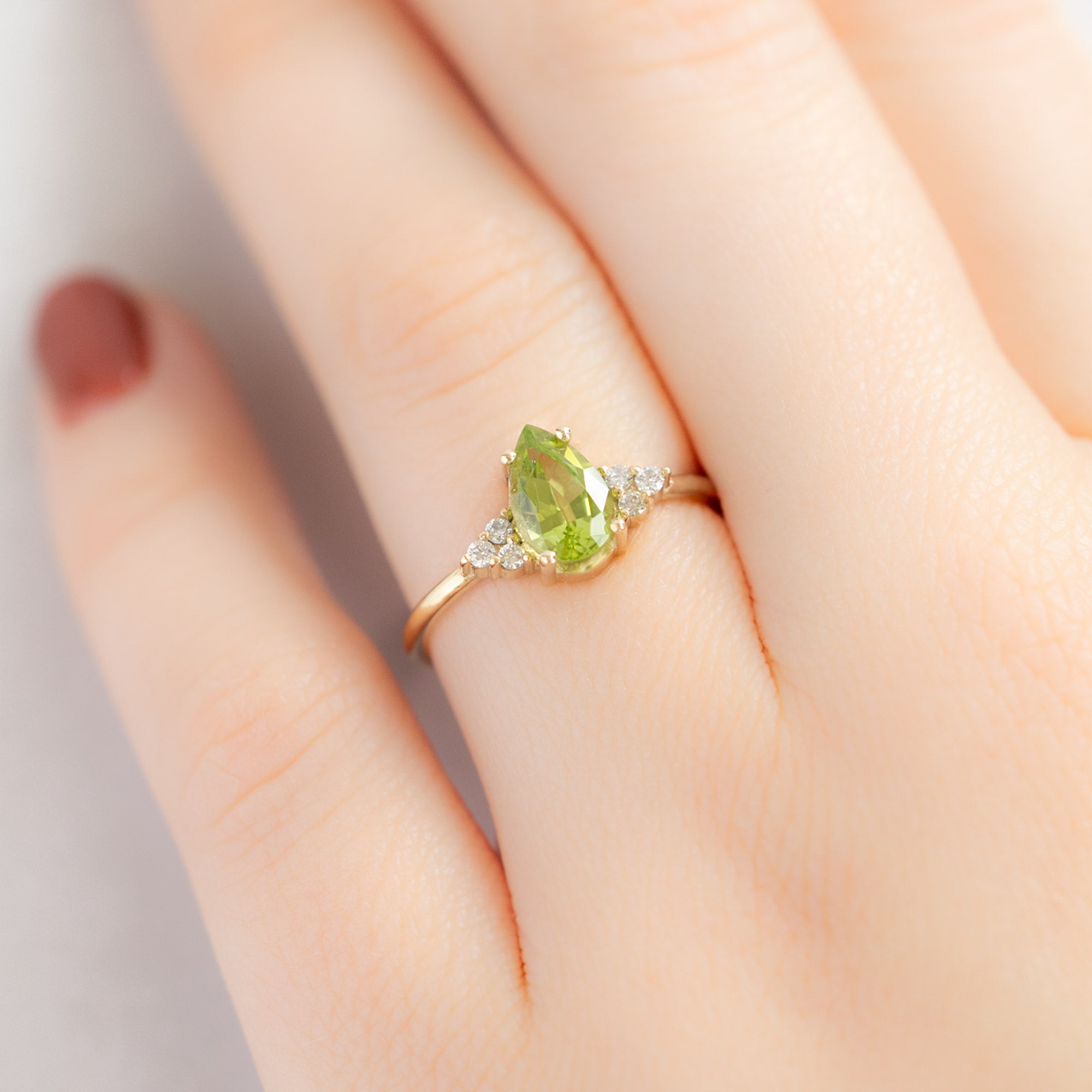 The Ivy Ring with a .89ct Pear Peridot in 14K Yellow Gold on Model