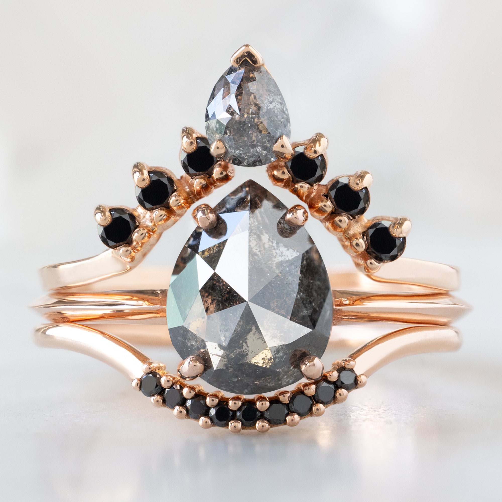 buy:pear-black-diamond-sunburst-stacking-band-14k-gold,the-bryn-ring-1-38ct-pear-salt-and-pepper-diamond-in-14k-rose-gold,black-diamond-pave-arc-stacking-band-14k-or-18k-rose-gold