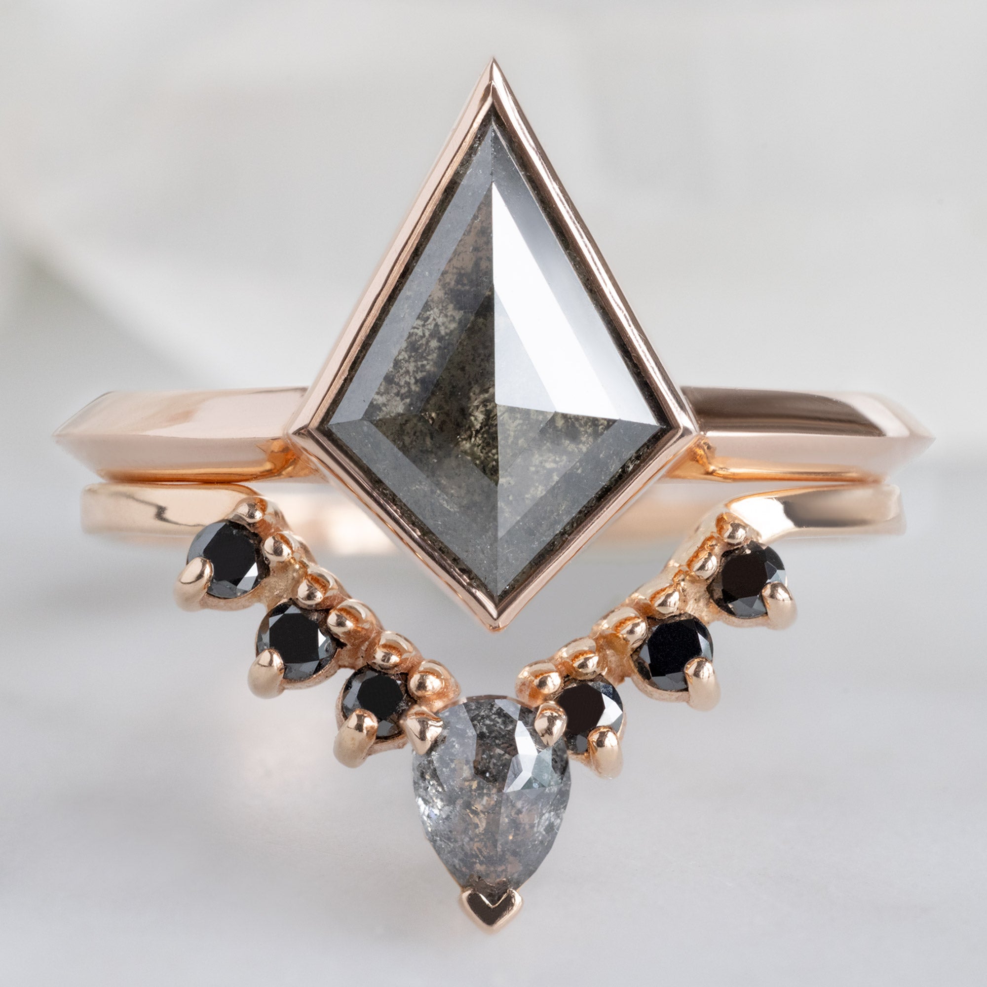 The Hazel Ring with a 1.52ct Kite Black Diamond in 14K Rose Gold Stacked with the Black Diamond Sunburst Stacking Band