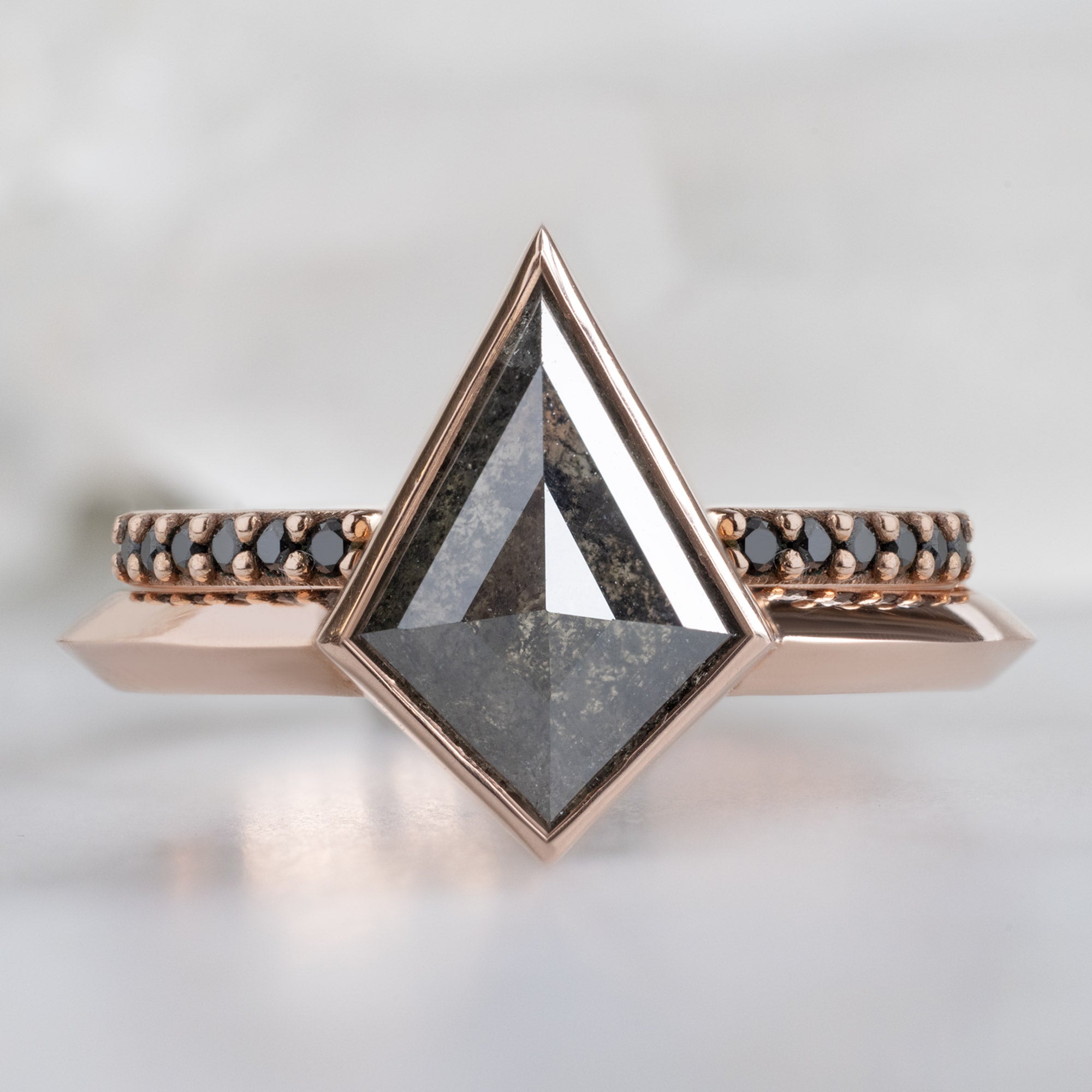 The Hazel Ring with a 1.52ct Kite Black Diamond in 14K Rose Gold Stacked with the Open Cuff Black Pavé Diamond Stacking Band