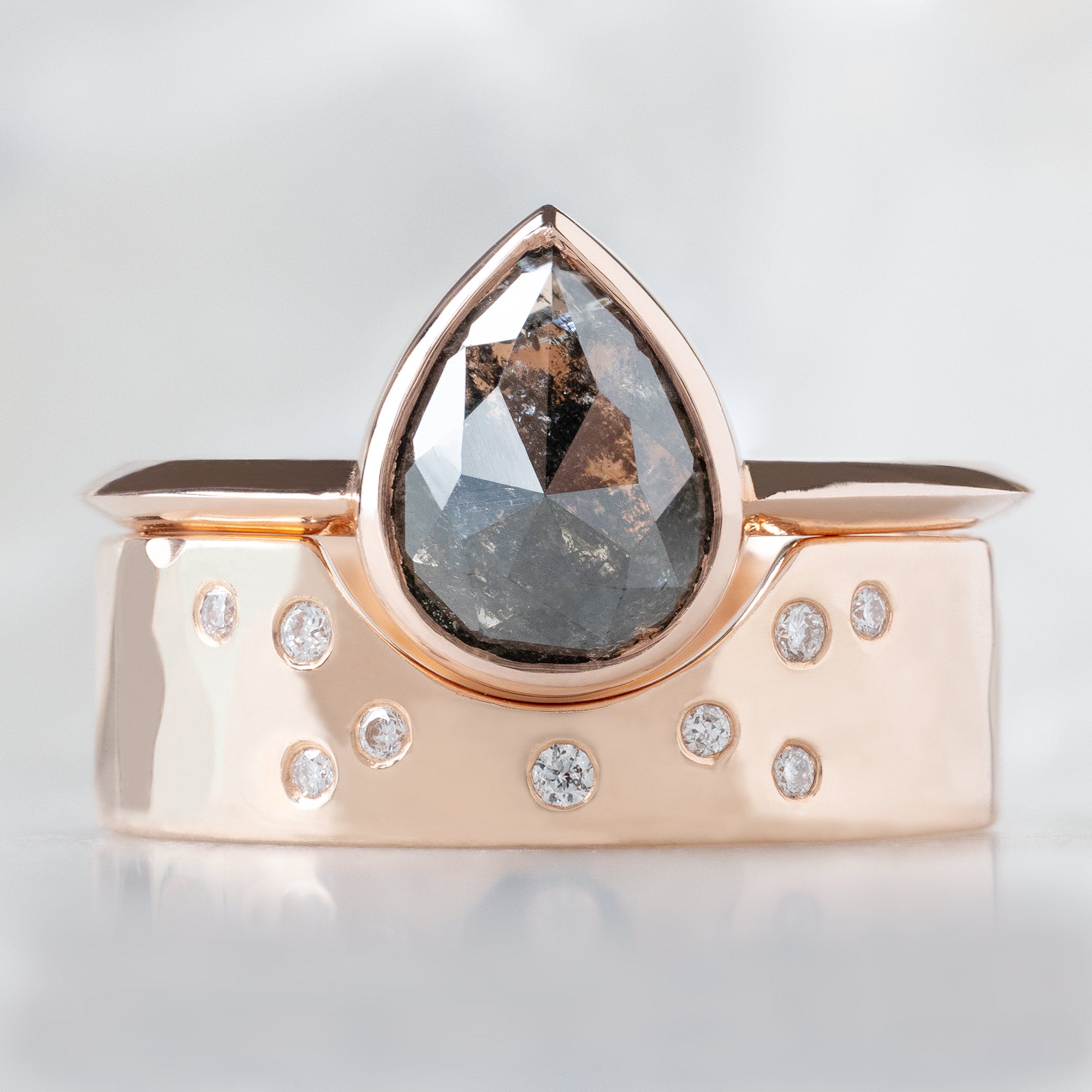 The Hazel Ring with a 1.68ct Rose Cut Black Diamond in 14K Rose Gold Stacked with the Constellation Arc Stacking Band