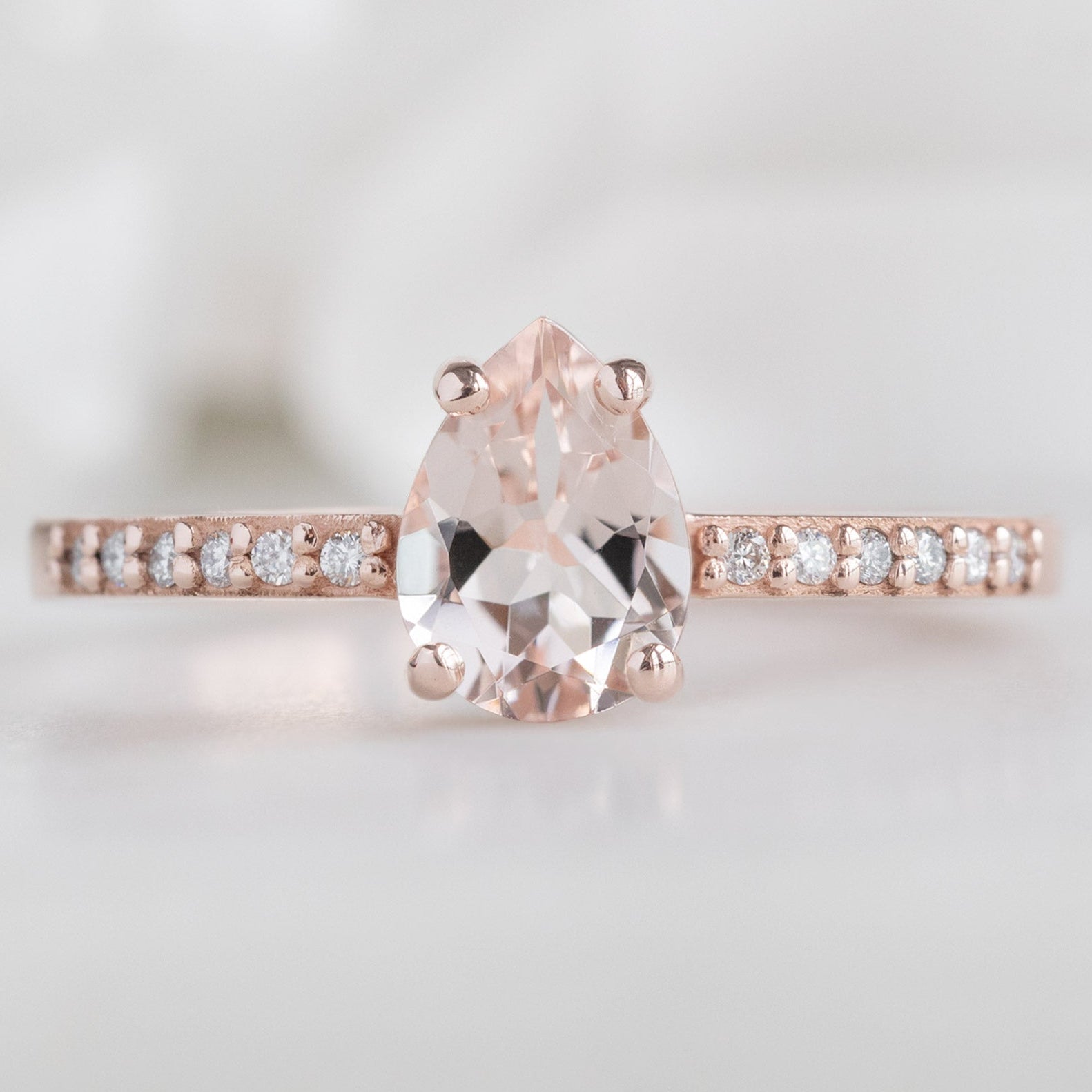 The Willow Ring with a 0.58ct Pear Morganite in 14K Rose Gold on White Marble