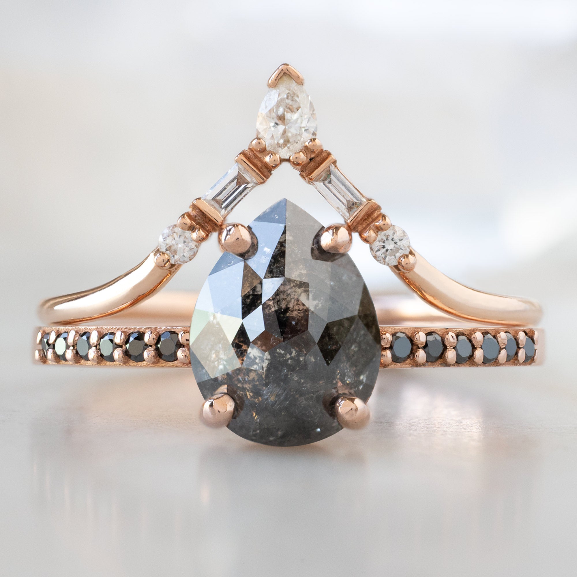 The Willow Ring with a 1.59ct Pear Black Diamond in 14K Rose Gold Stacked with the White Diamond Tiara Stacking Band