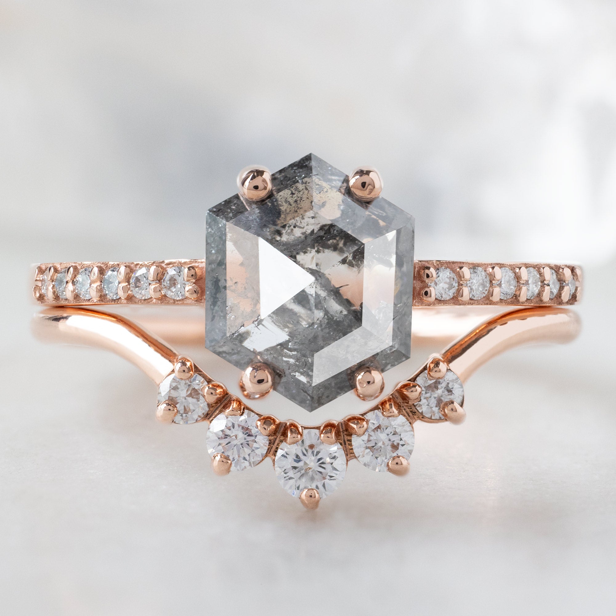 The Willow Ring with a 1.35ct Hexagon Salt and Pepper Diamond in 14K Rose Gold Stacked with the Round White Diamond Sunburst Stacking Band