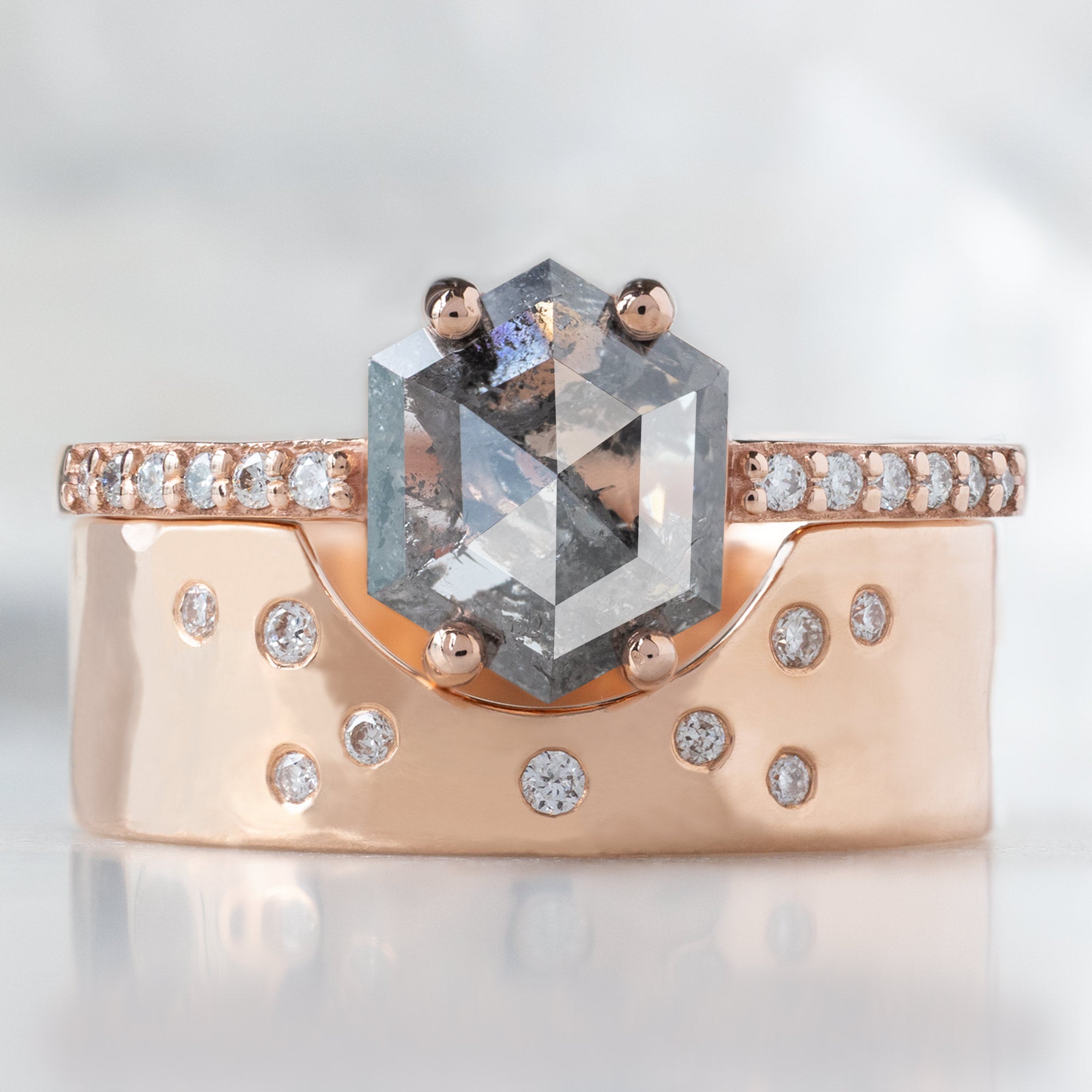 The Willow Ring with a 1.35ct Hexagon Salt and Pepper Diamond in 14K Rose Gold Stacked with the Arc Cut Out Constellation Stacking Band