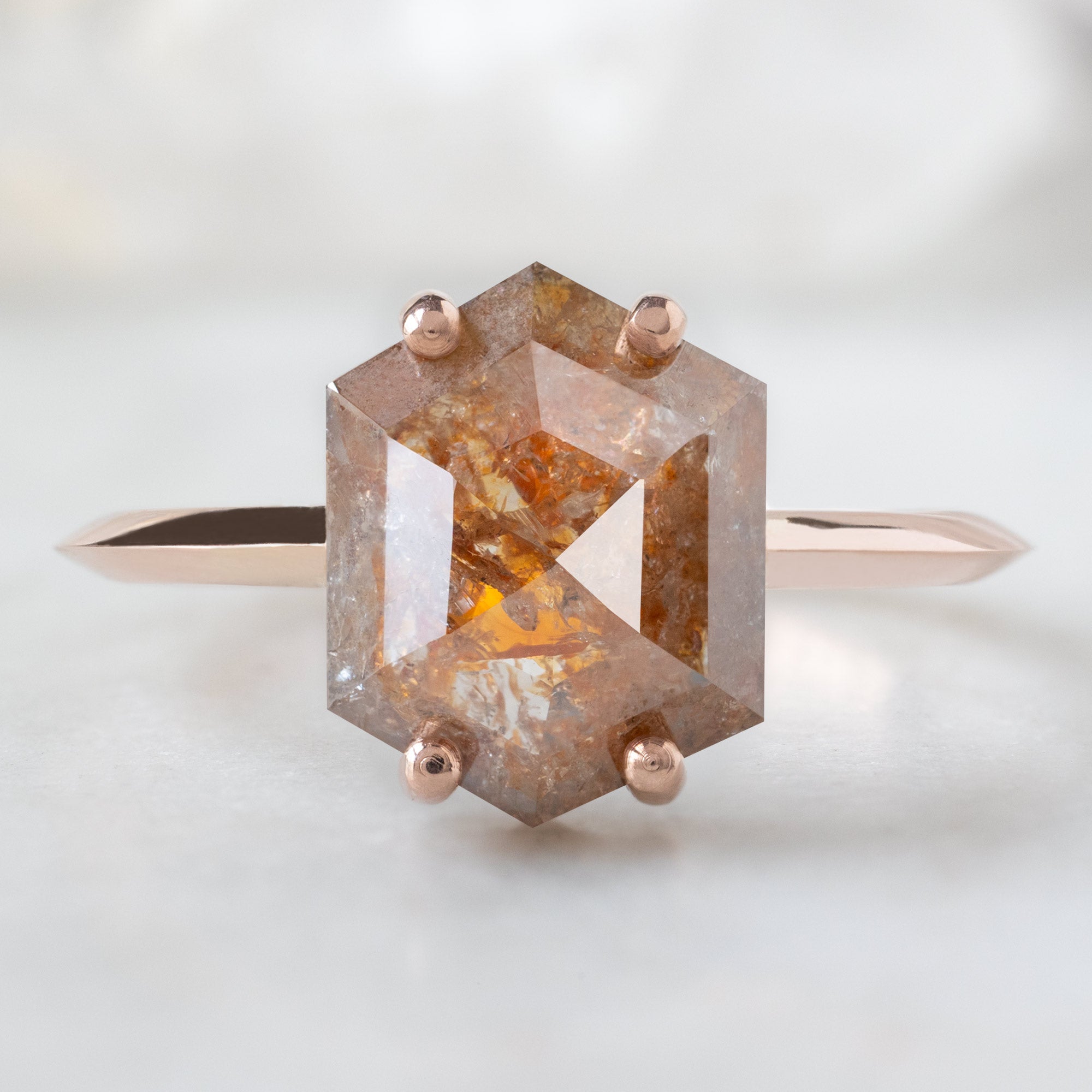 The Bryn Ring with a 2.03ct Hexagon Red Diamond in 14K Rose Gold on White Marble