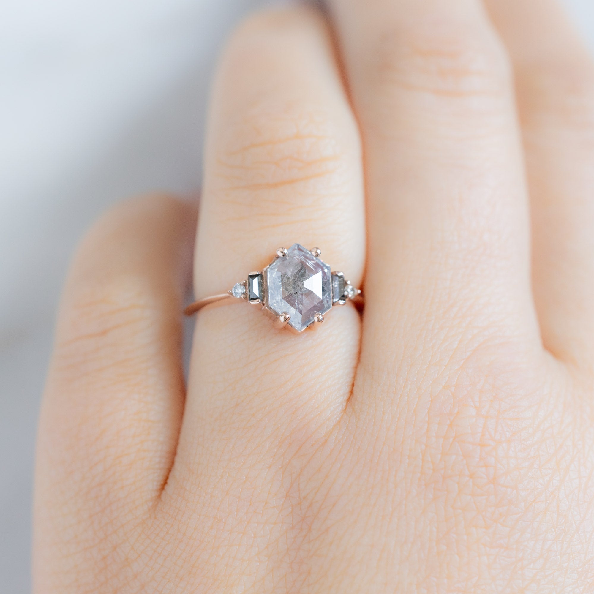 The Primrose Ring with a 1.21ct Hexagon Salt and Pepper Diamond in 14K Rose Gold on Model