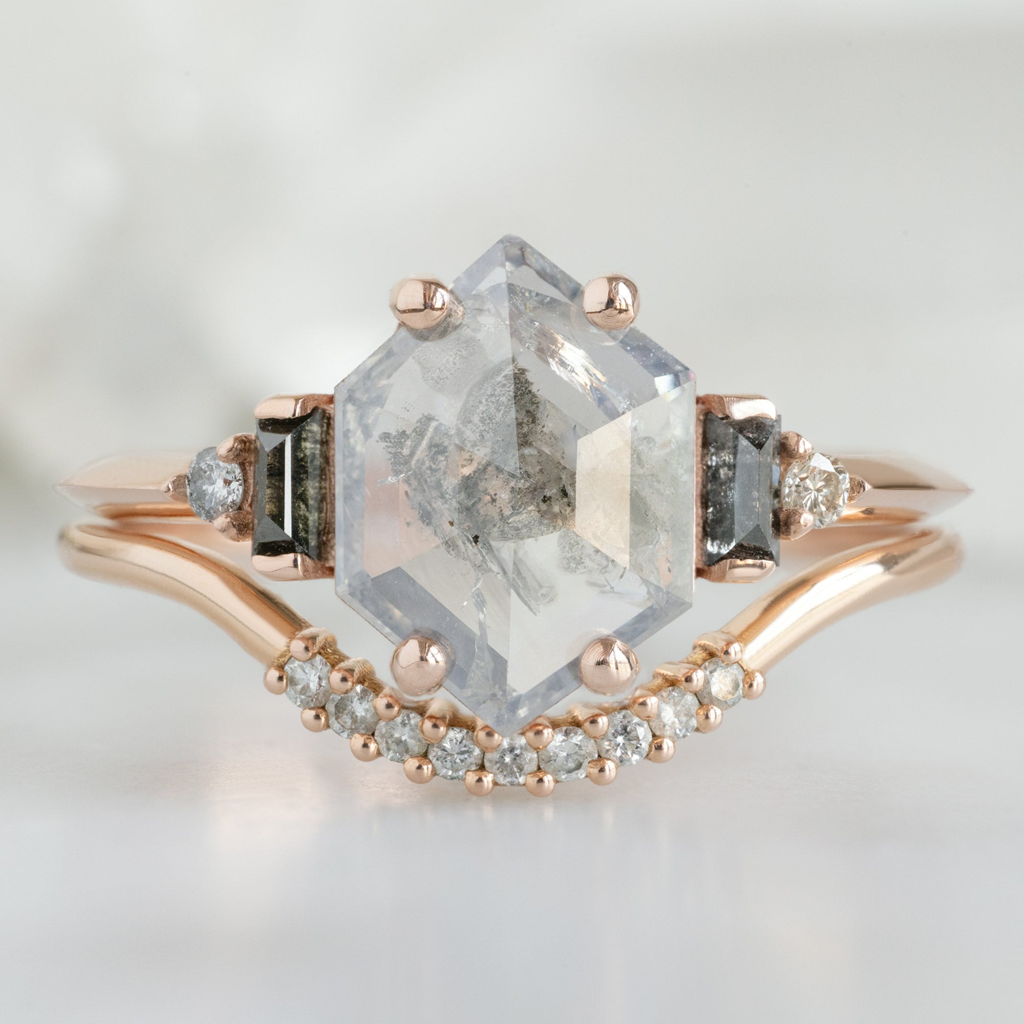 The Primrose Ring with a 1.21ct Hexagon Salt and Pepper Diamond in 14K Rose Gold Stacked with the White Pavé Diamond Arc Stacking Band