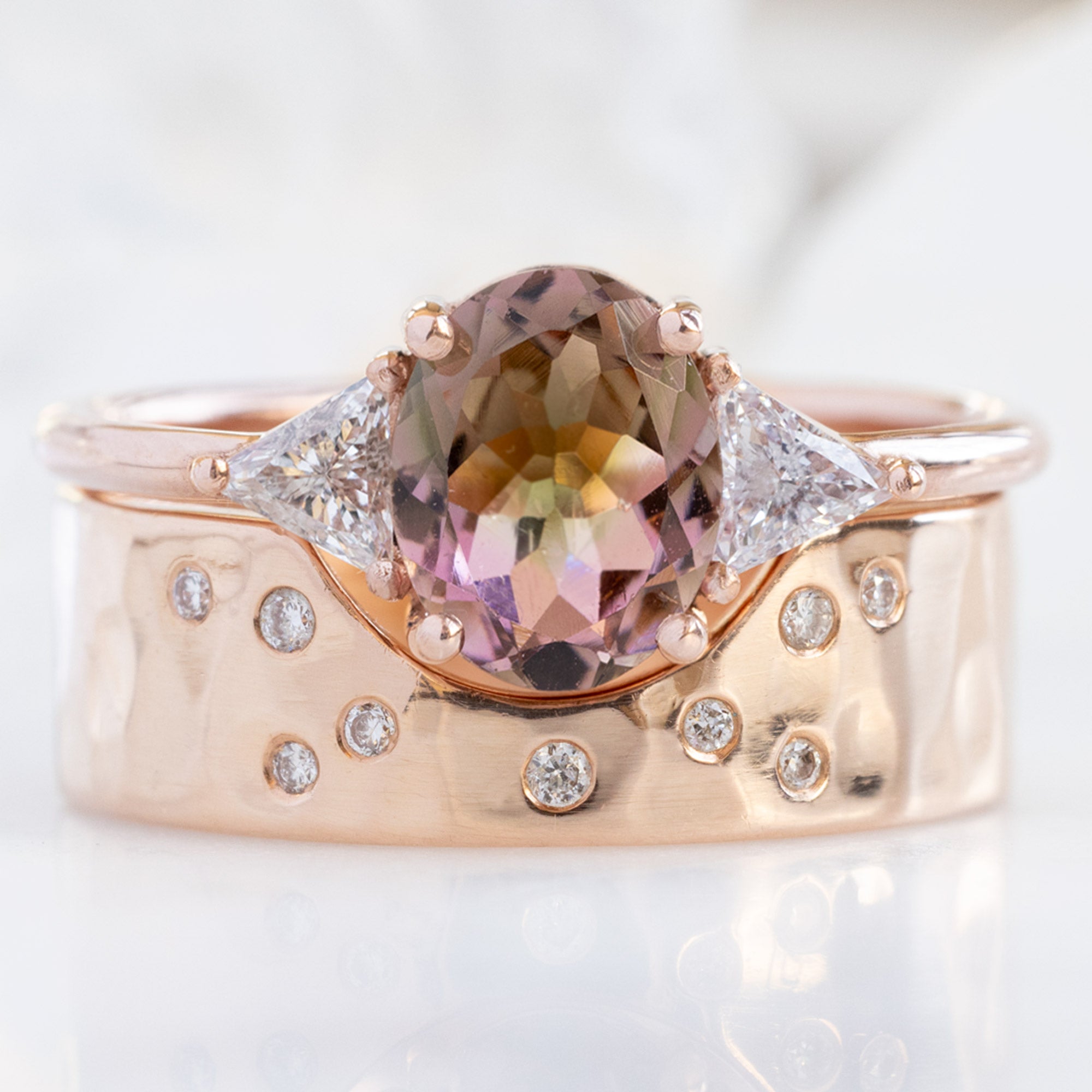 The Jade Ring with an Oval Bicolor Tourmaline in 14K Rose Gold Stacked with the Constellation Arc Cut Out Stacking Band