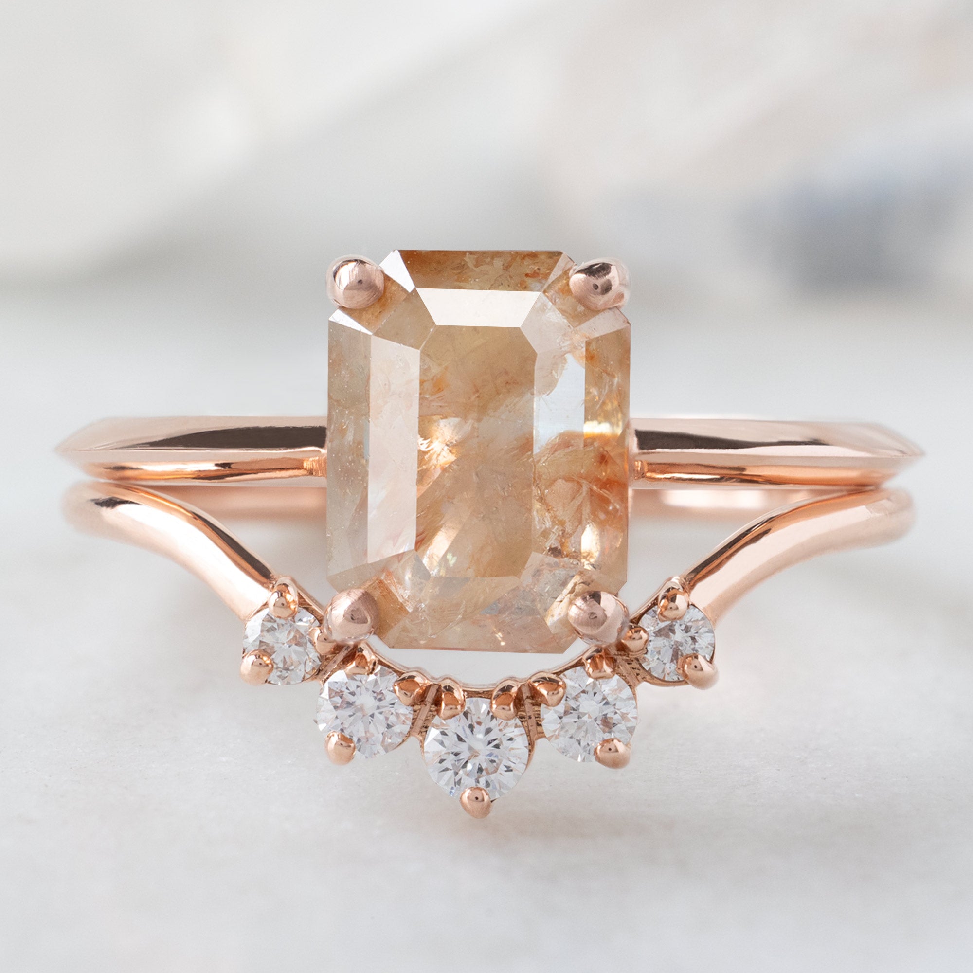 The Bryn Ring with an Emerald-Cut Red Diamond in 14K Rose Gold Stacked with the Round White Diamond Sunburst Stacking Band