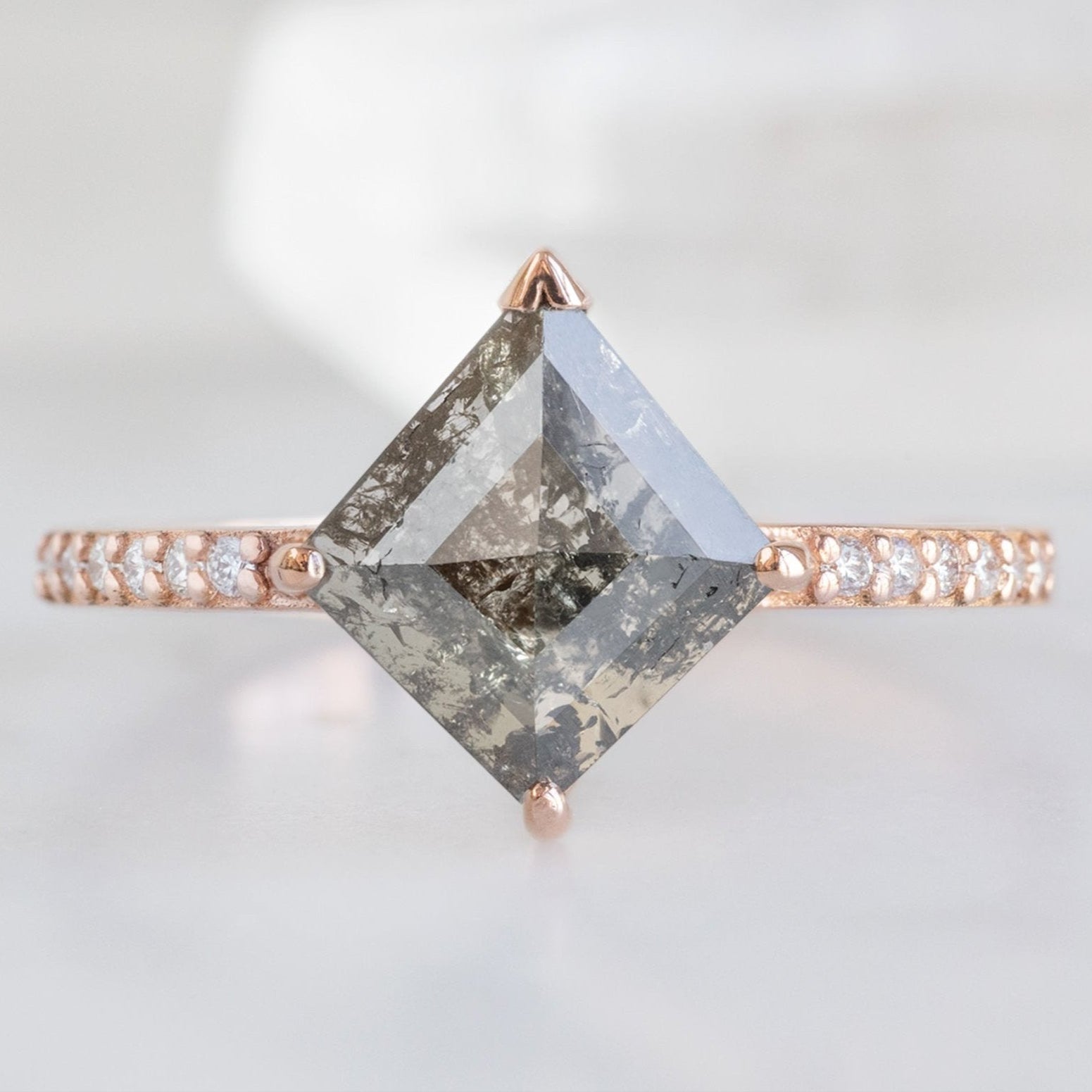 The Willow Ring with a Kite Shaped Salt and Pepper Diamond in 14K Rose Gold on White Marble
